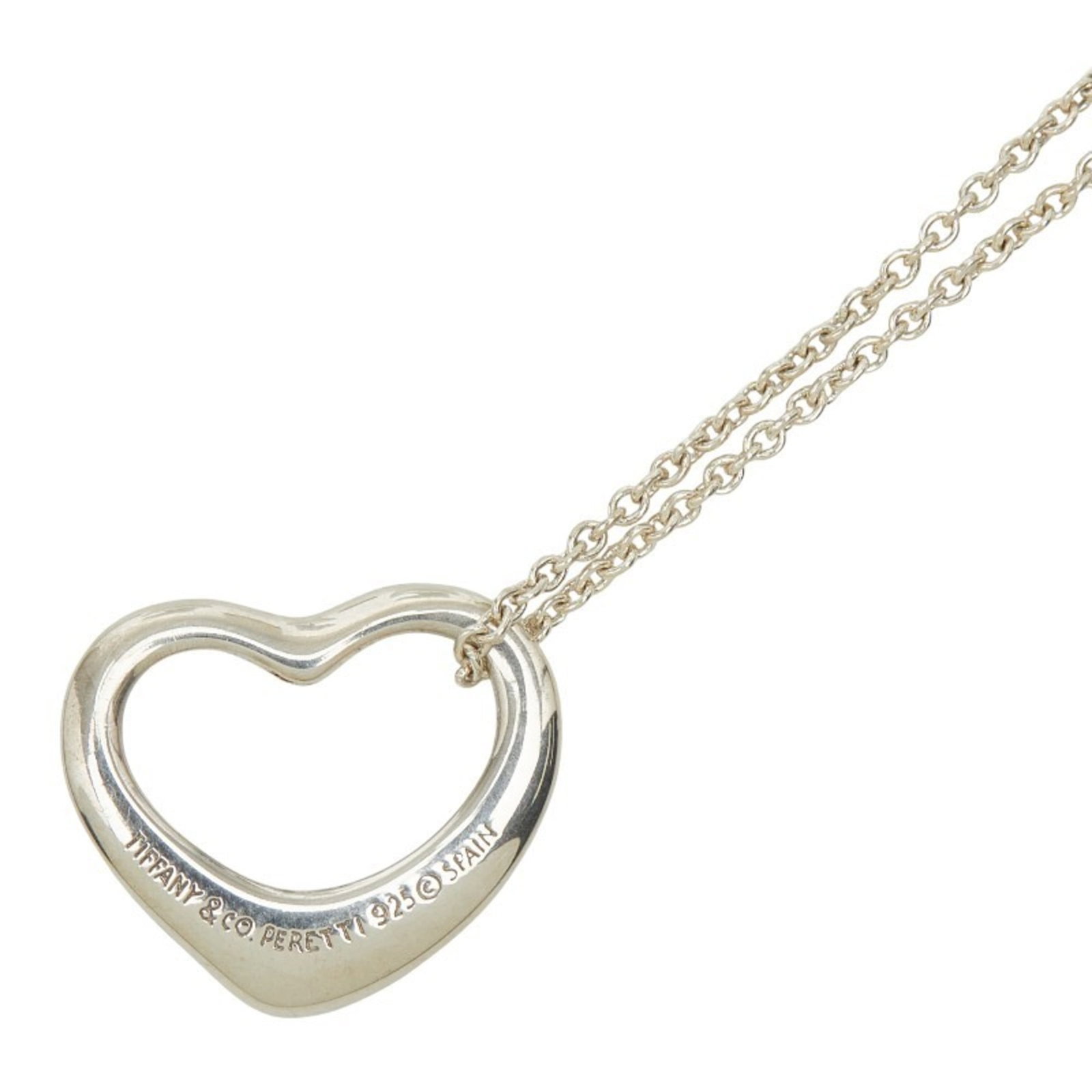 Tiffany & Co. Open Heart Necklace In 925 Sterling Silver For Women.: Tiffany & Co. Open Heart Necklace In 925 Sterling Silver For Women. Tiffany & Co. Open Heart Necklace in 925 Sterling Silver features a delicate design with a pendant size of 12.4mm x 15mm, suspended
