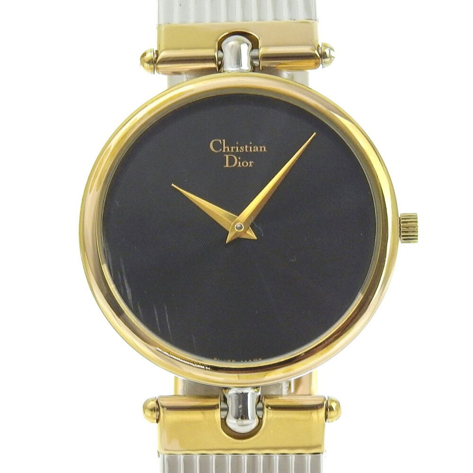 Christian Dior Wristwatch: Christian Dior Wristwatch Gold plated case and stainless steel band make this Christian Dior wristwatch a stylish accessory. The black dial stands out against the metallic tones, adding a touch of