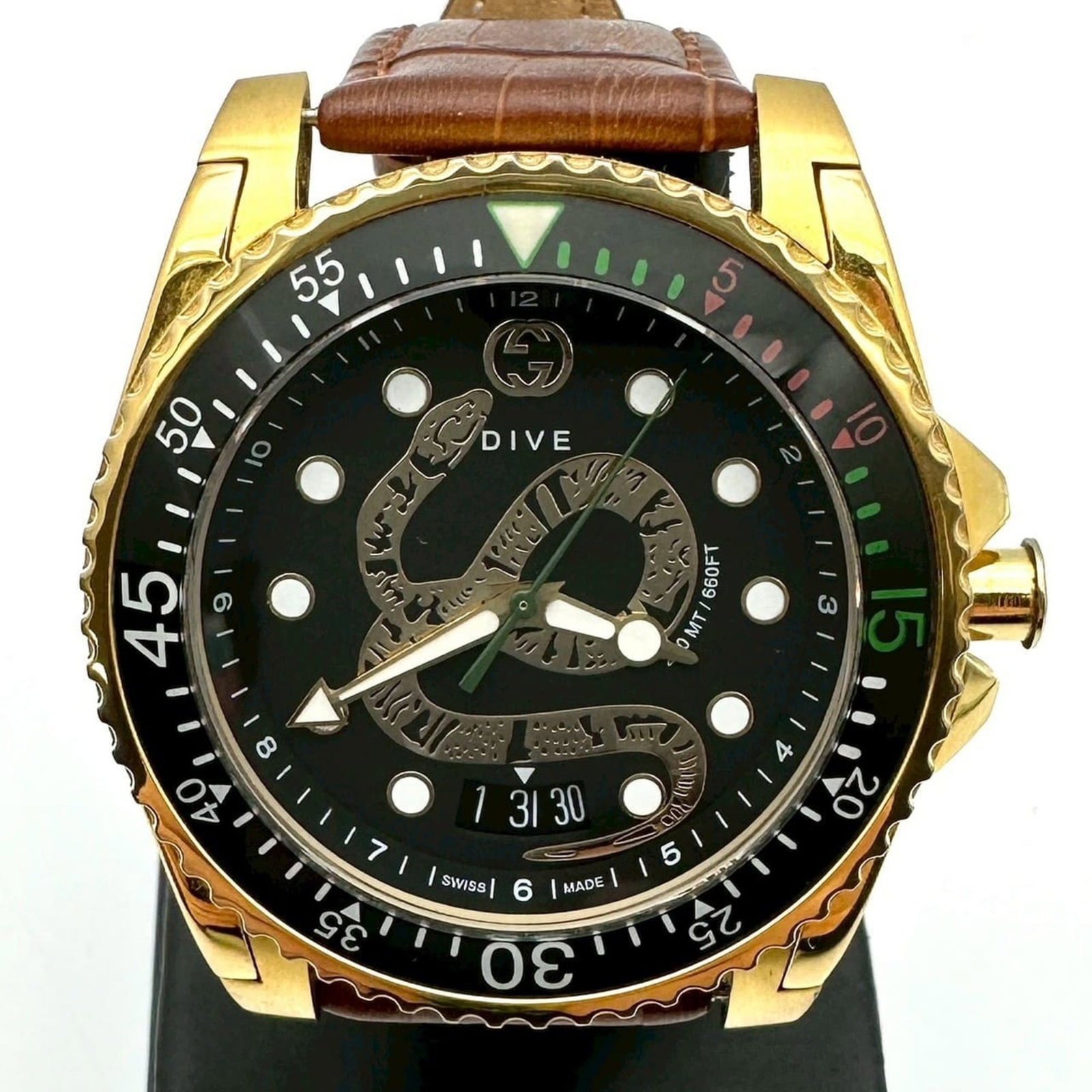 Wristwatch by Gucci: Wristwatch by Gucci Stainless steel case and black dial make for a sleek, modern look. This Gucci dive-style wristwatch features an analog display and quartz movement, with a comfortable fit for