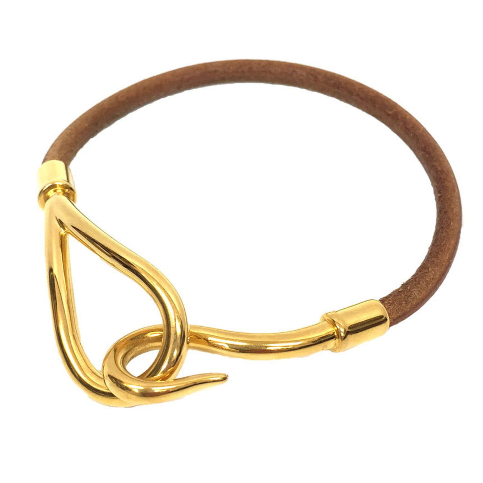Hermes Charm Leather Brass: Hermes Charm Leather Brass Brass and leather come together in a classic charm bracelet from Hermes, featuring a timeless design with brown and camel tones. The 17.5cm length provides a versatile fit f