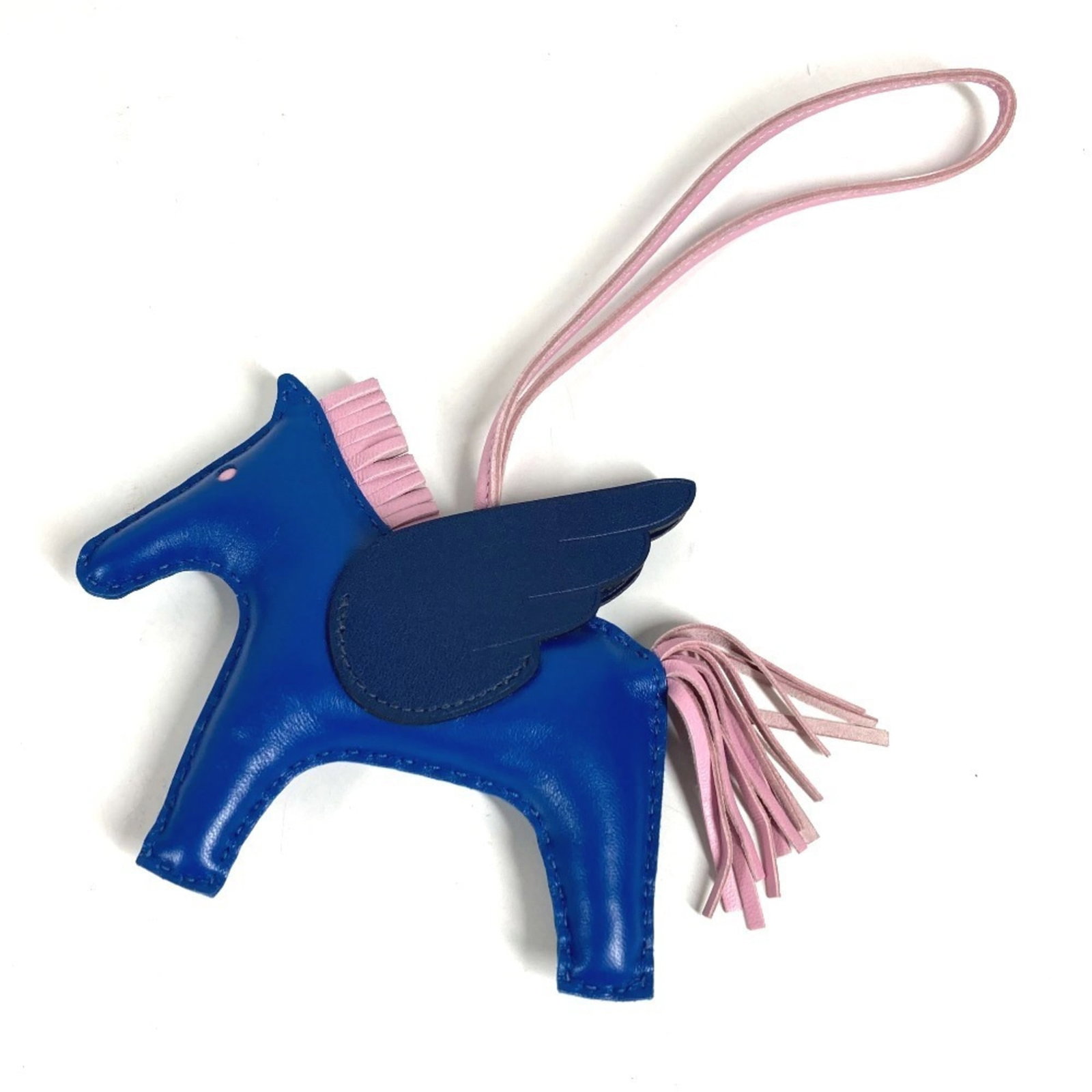 Hermes agneau handbag charm Milo: Hermes agneau handbag charm Milo Agneau Milo, the iconic handbag charm from Hermes, adds a touch of elegance to any accessory. Made from high-quality agneau material, this charming piece boasts a