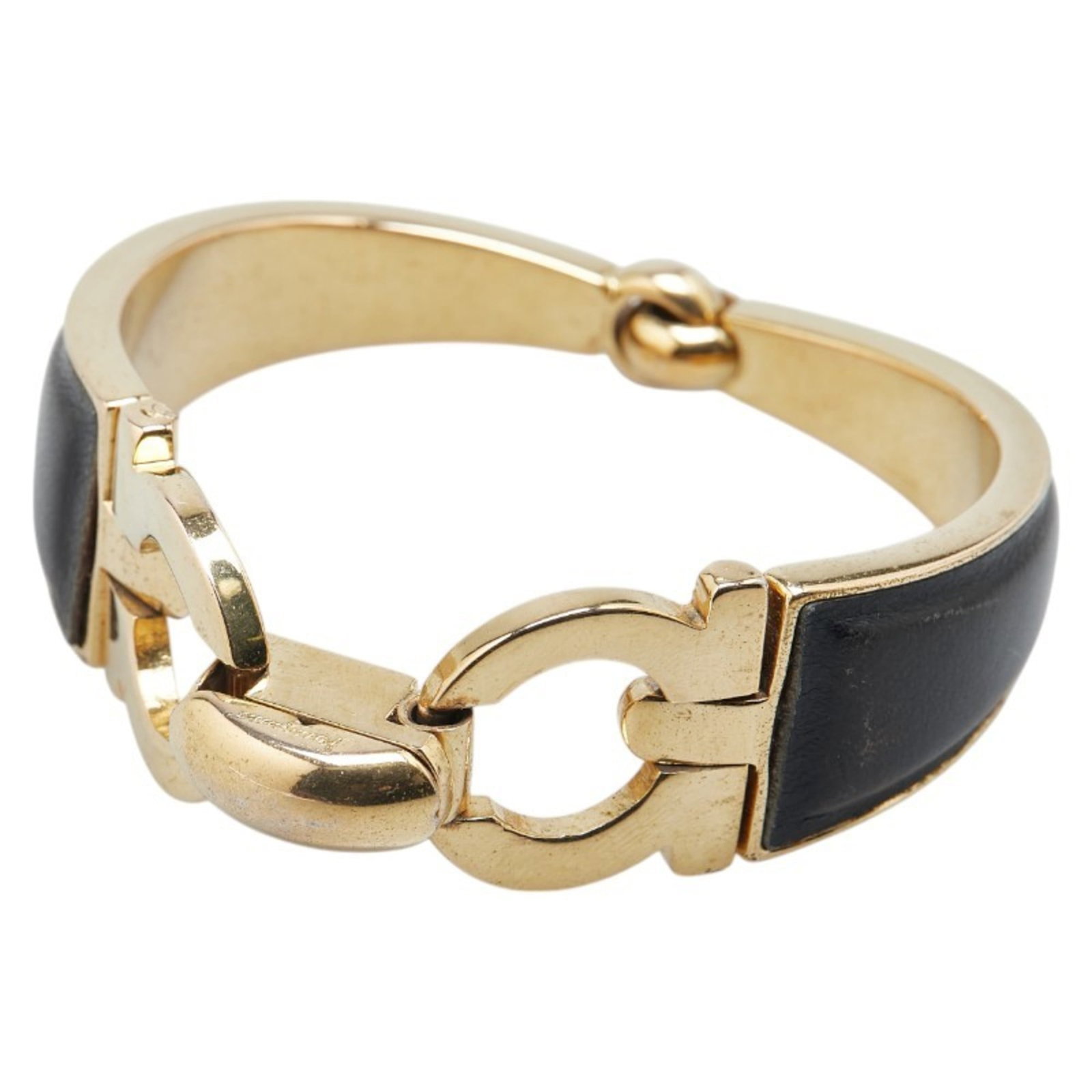 Bangle leather Salvatore Ferragamo: Bangle leather Salvatore Ferragamo Salvatore Ferragamo's Gancini bangle leather accessory boasts sleek, modern design with a sophisticated black and gold color scheme. Crafted from high-quality