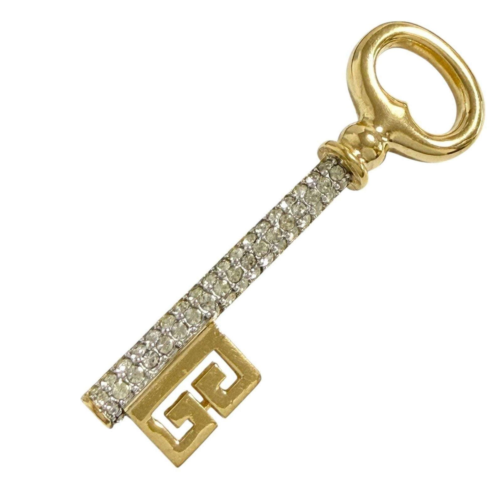 Metal Rhinestone Brooch Givenchy: Metal Rhinestone Brooch Givenchy Metal Rhinestone Brooch Givenchy. This brooch features metal and rhinestone material, making it a striking piece to add to your collection. The signature from the