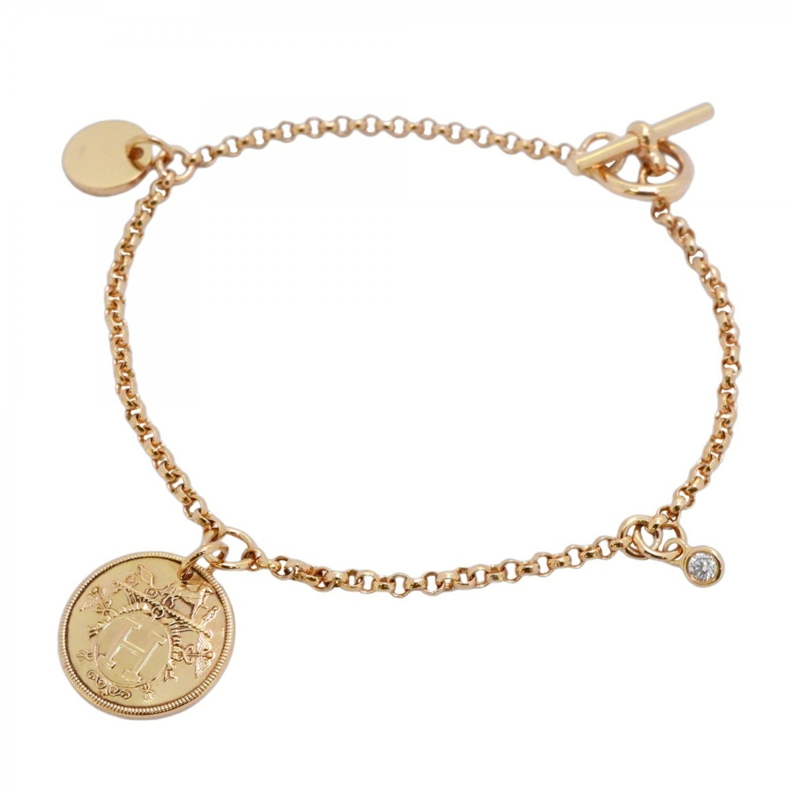 Pink Gold 18K Hermes Charm Bracelet: Pink Gold 18K Hermes Charm Bracelet Pink gold (18K) charm bracelet from Hermes, featuring a diamond stone and measuring 16cm in length. This elegant piece showcases the luxury brand's signature style 