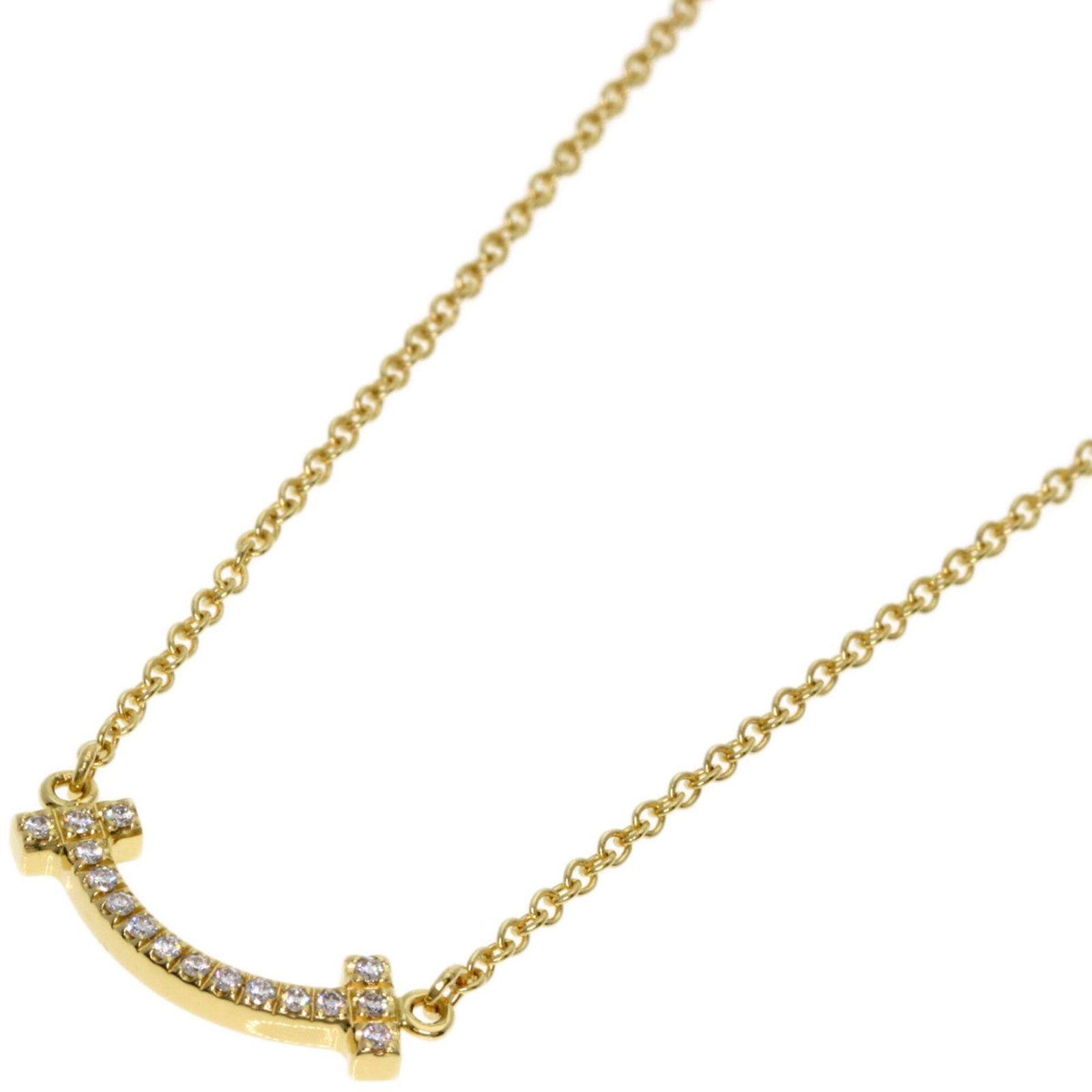 Tiffany & Co. T Smile Mini Diamond Necklace 18K Yellow Gold Women'S.: Tiffany & Co. T Smile Mini Diamond Necklace 18K Yellow Gold Women'S. 18K Yellow Gold Mini Diamond Necklace with Delicate Charm. This elegant necklace features a petite diamond pendant suspended from