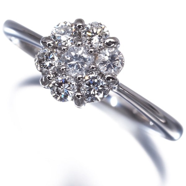 Diamond 0.51Ct Flower 7P Ring 900 Platinum: Diamond 0.51Ct Flower 7P Ring 900 Platinum The 0.51ct diamond flower ring boasts a stunning natural diamond set in 900 platinum metal, creating a beautiful and elegant design. This unique piece