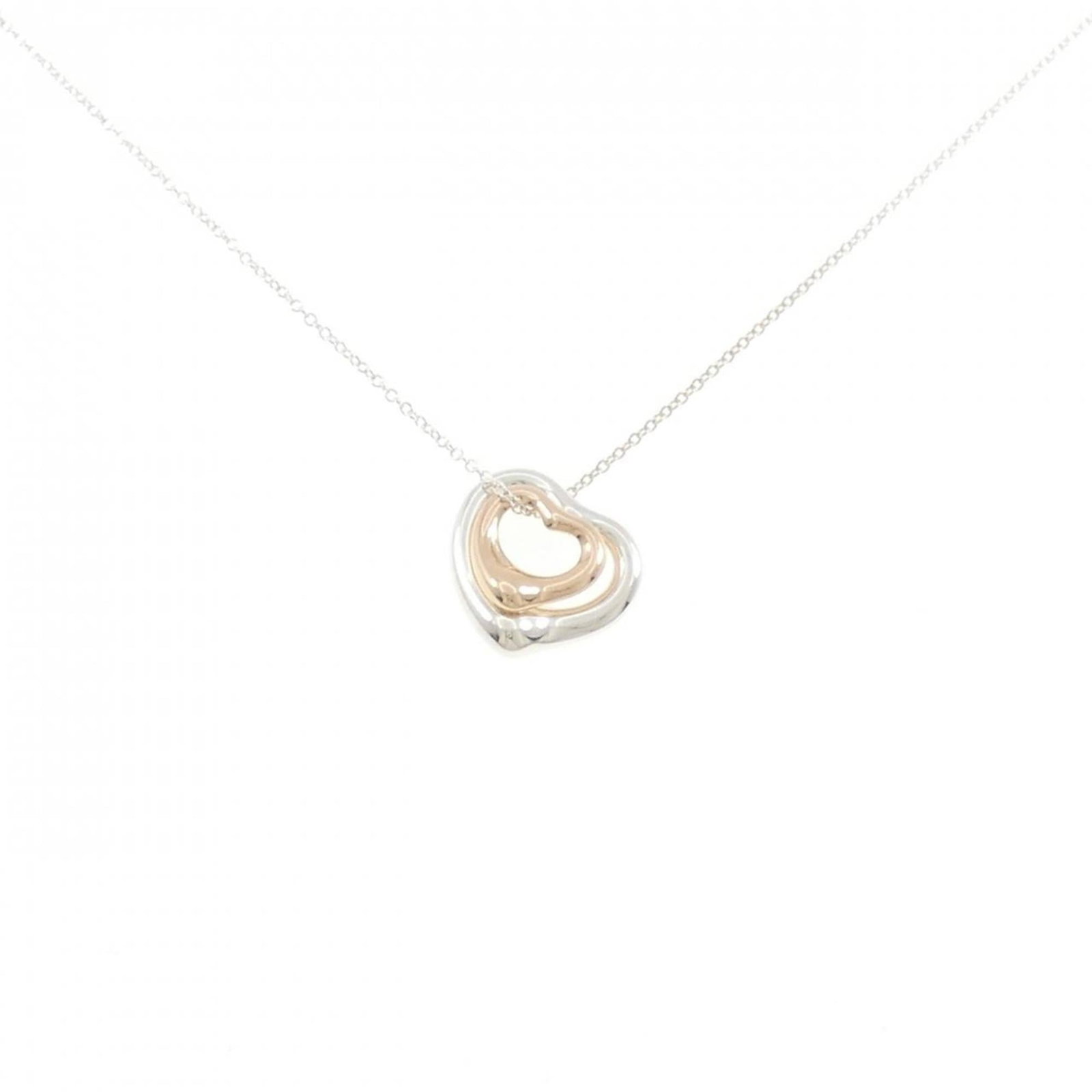 Heart Necklace by Tiffany: Heart Necklace by Tiffany Pink gold (18K) and silver 925 combine in the elegant Heart Necklace by Tiffany, featuring a pendant with a classic design. The necklace has a comfortable neck circumference
