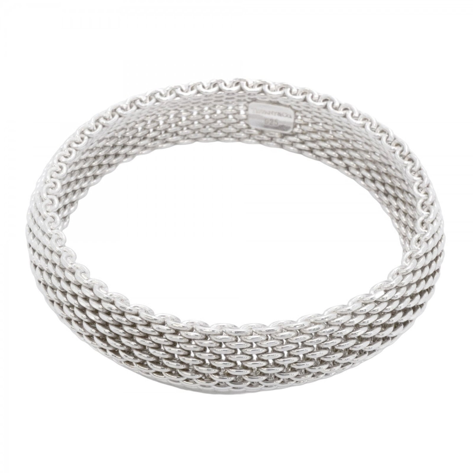 Silver Tiffany Bangle 925: Silver Tiffany Bangle 925 Silver Tiffany Bangle 925 - A sleek and modern bangle crafted from high-quality silver, measuring 19cm in length. This piece bears a signature, adding a touch of personal fla