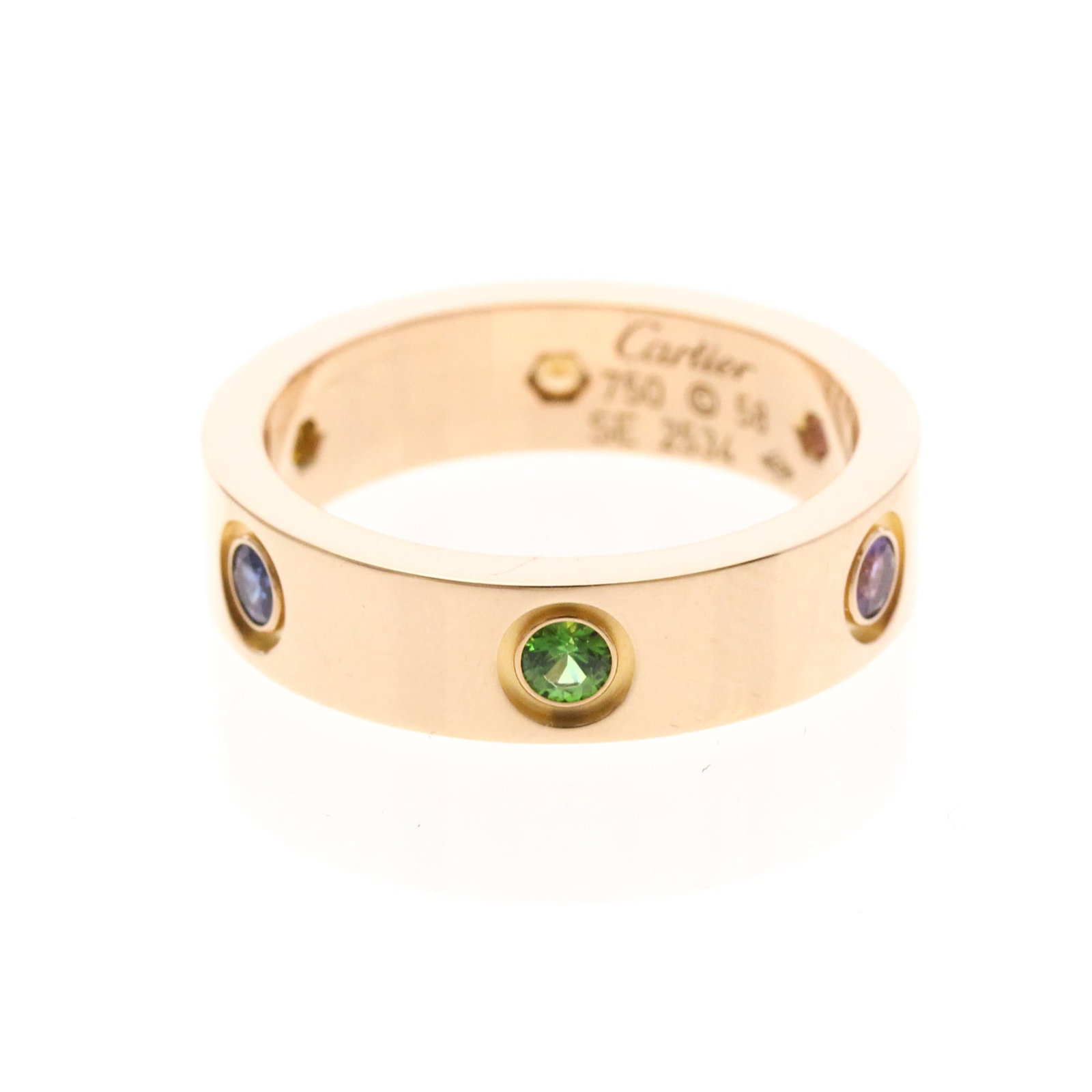 Pink Gold Ring Band Cartier: Pink Gold Ring Band Cartier Pink gold band ring from Cartier, featuring a unique multistone design with amethyst, citrine, garnet, and sapphire stones. The ring's 18K pink gold construction provides