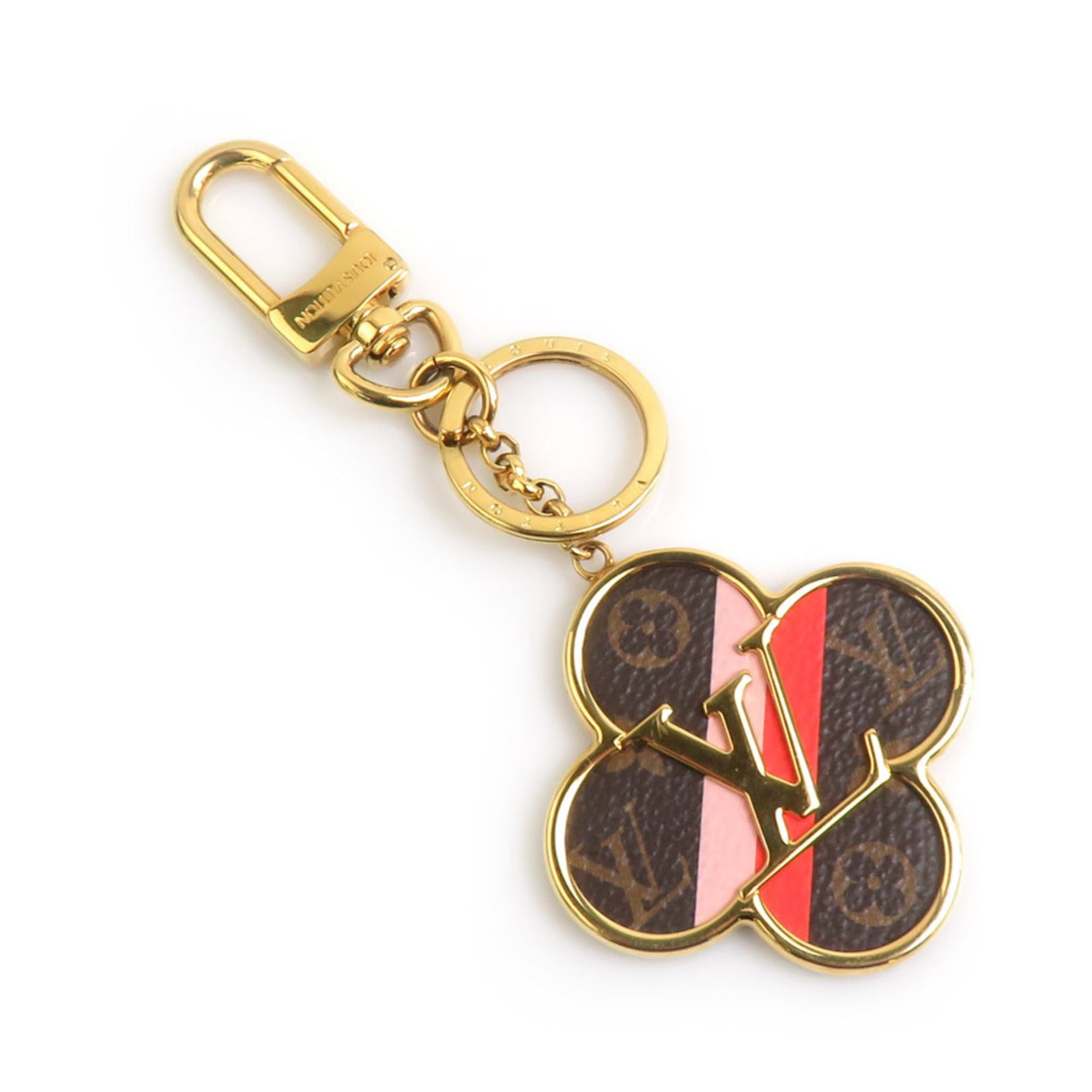 Handbag Metal Louis Vuitton: Handbag Metal Louis Vuitton Metal Louis Vuitton charm in brown, gold, and pink hues. This intricately designed metal handbag charm measures 137mm x 57mm x 5.39'' x 2.24''. The charm bears a