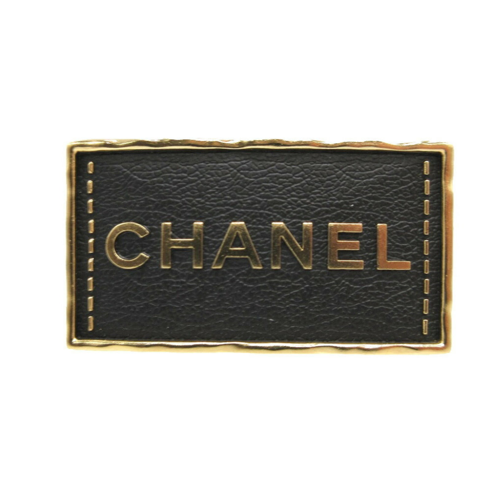 Metal Chanel Brooch: Metal Chanel Brooch Black metal brooch with gold accents, measuring 3cm x 5.6cm in size, comes packaged in a box and dust bag. This Chanel brooch showcases its sleek design and metallic finish,