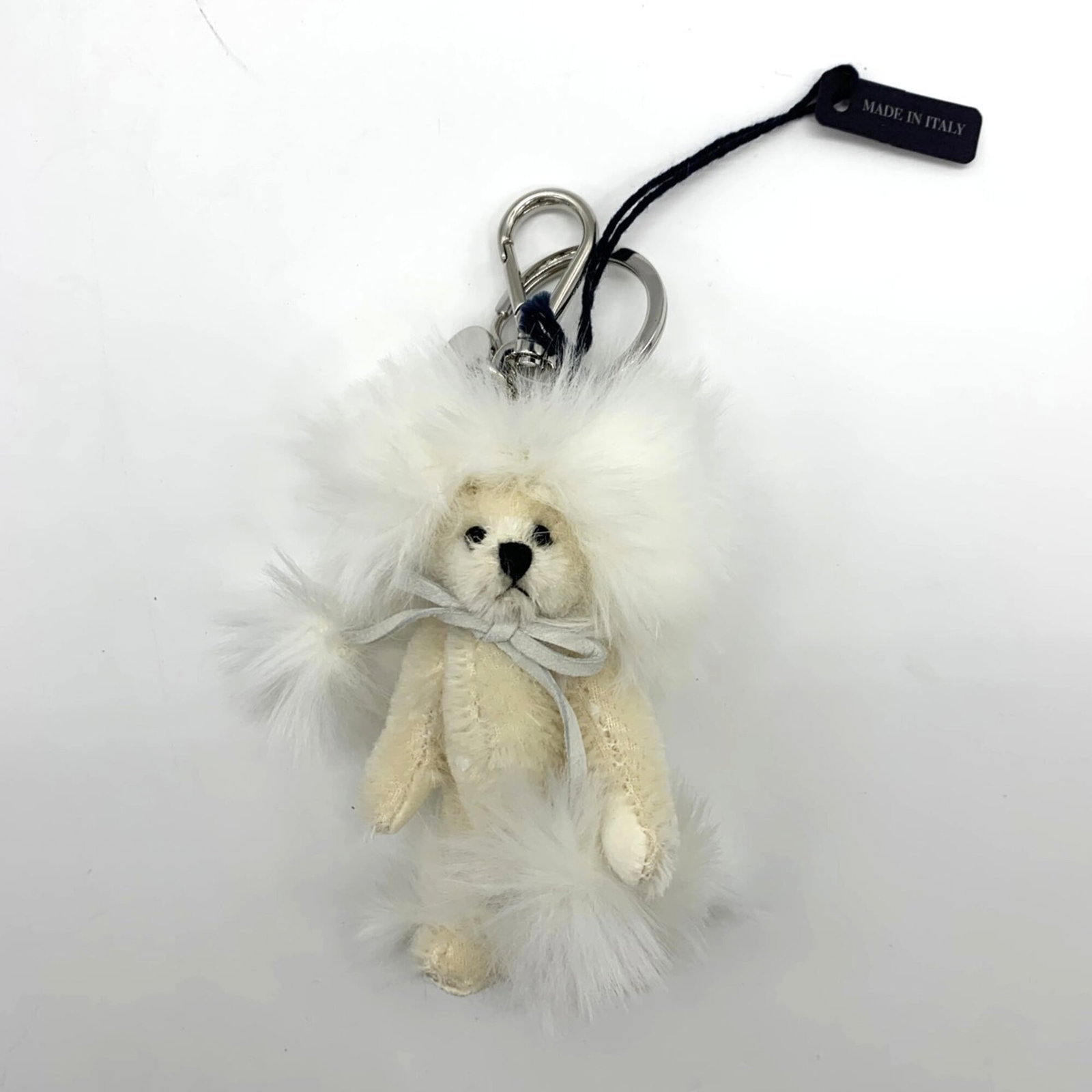 Cotton Handbag Charm Prada: Cotton Handbag Charm Prada Cotton Handbag Charm Prada bears a signature, made from cotton with dimensions 135.00mm x 60.00mm and weighing 36.6g. This charm's size and weight are notable features that