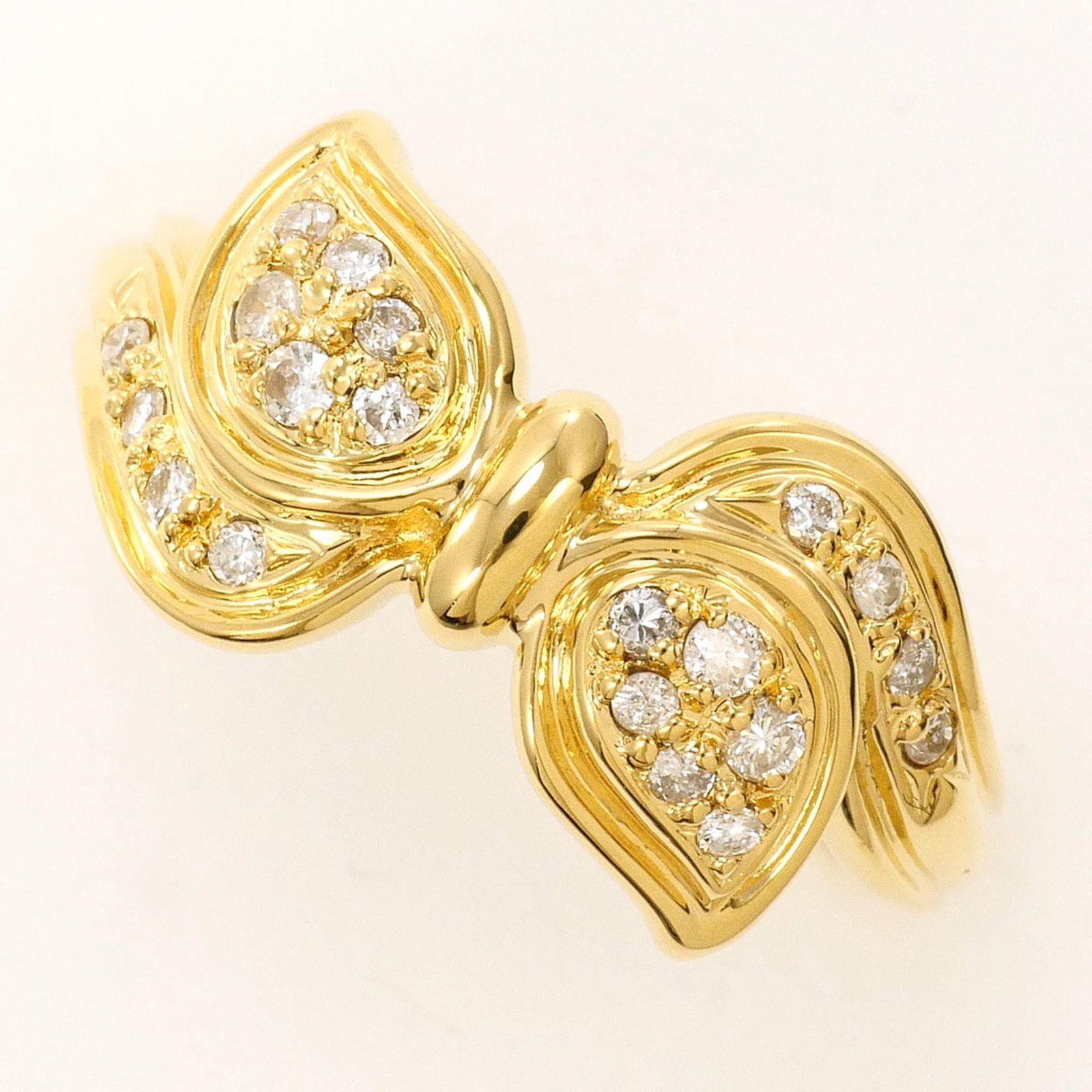 Unbranded Band Ring Yellow Gold (18K): Unbranded Band Ring Yellow Gold (18K) Yellow gold band ring with a diamond accent, crafted from 18K metal and available in US size 5.5 and Japanese size 10. The 0.19 carat diamond adds a touch of