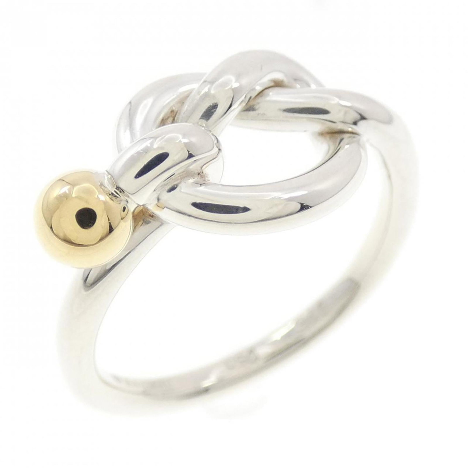 Tiffany Band Ring Silver 925 Yellow Gold (18K): Tiffany Band Ring Silver 925 Yellow Gold (18K) Silver and yellow gold combine in this elegant Tiffany band ring, crafted from high-quality materials. The 18K yellow gold accents add a touch of luxury