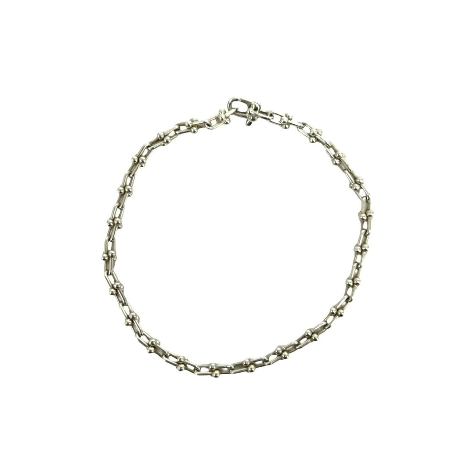 Tiffany Link Bracelet Silver 925: Tiffany Link Bracelet Silver 925 Silver 925 Tiffany Link Bracelet, featuring a sleek and modern design with a silver finish. This 19.5cm long link bracelet is made from high-quality sterling silver, p