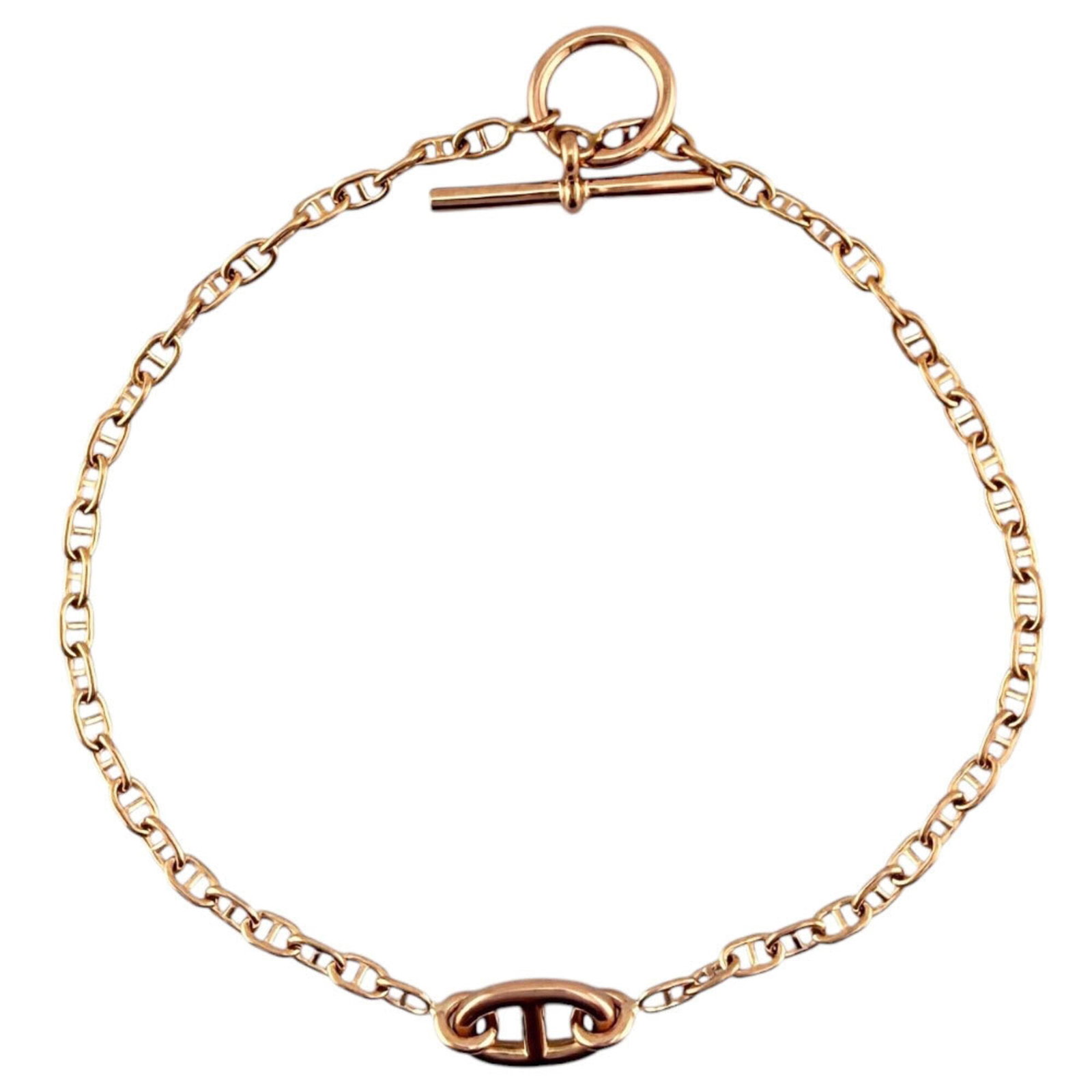 Pink Gold 18K Hermes Charm Bracelet: Pink Gold 18K Hermes Charm Bracelet Pink gold 18K Hermes Charm Bracelet. This 18cm pink gold charm bracelet boasts a delicate and elegant design, perfect for adding a touch of sophistication to any