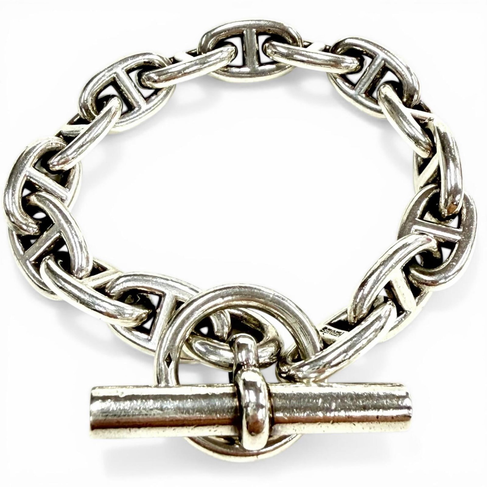 Charm Bracelet Silver 925 by Hermes: Charm Bracelet Silver 925 by Hermes Silver 925 by Hermes Charm Bracelet, 20cm in length. This charm bracelet features silver 925 material and a distinctive design. A stylish accessory for those who