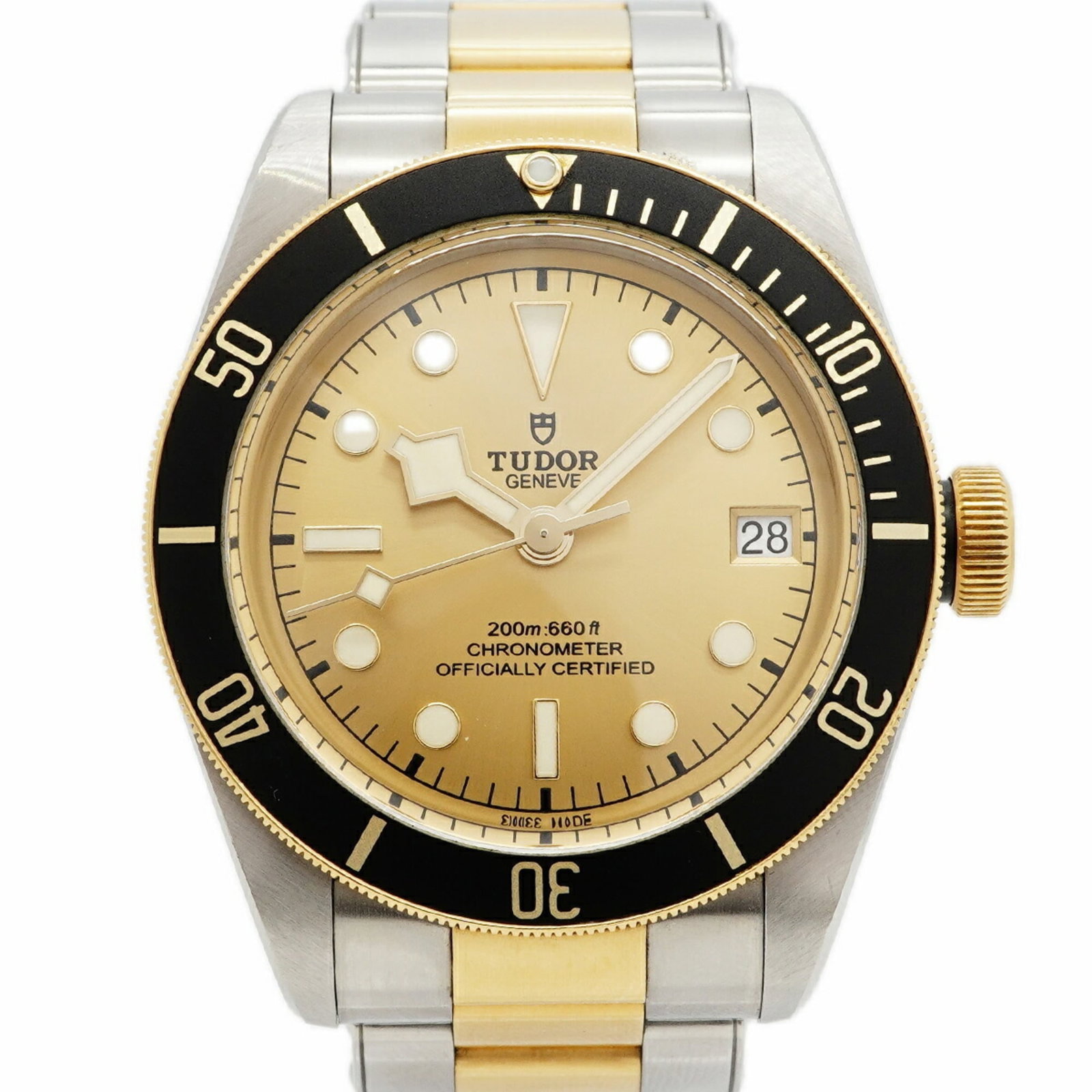 Tudor Wristwatch: Tudor Wristwatch Stainless steel and yellow gold blend in this 41mm Tudor wristwatch, featuring a self-winding automatic movement. The gold dial complements the watch's classic design, making it a