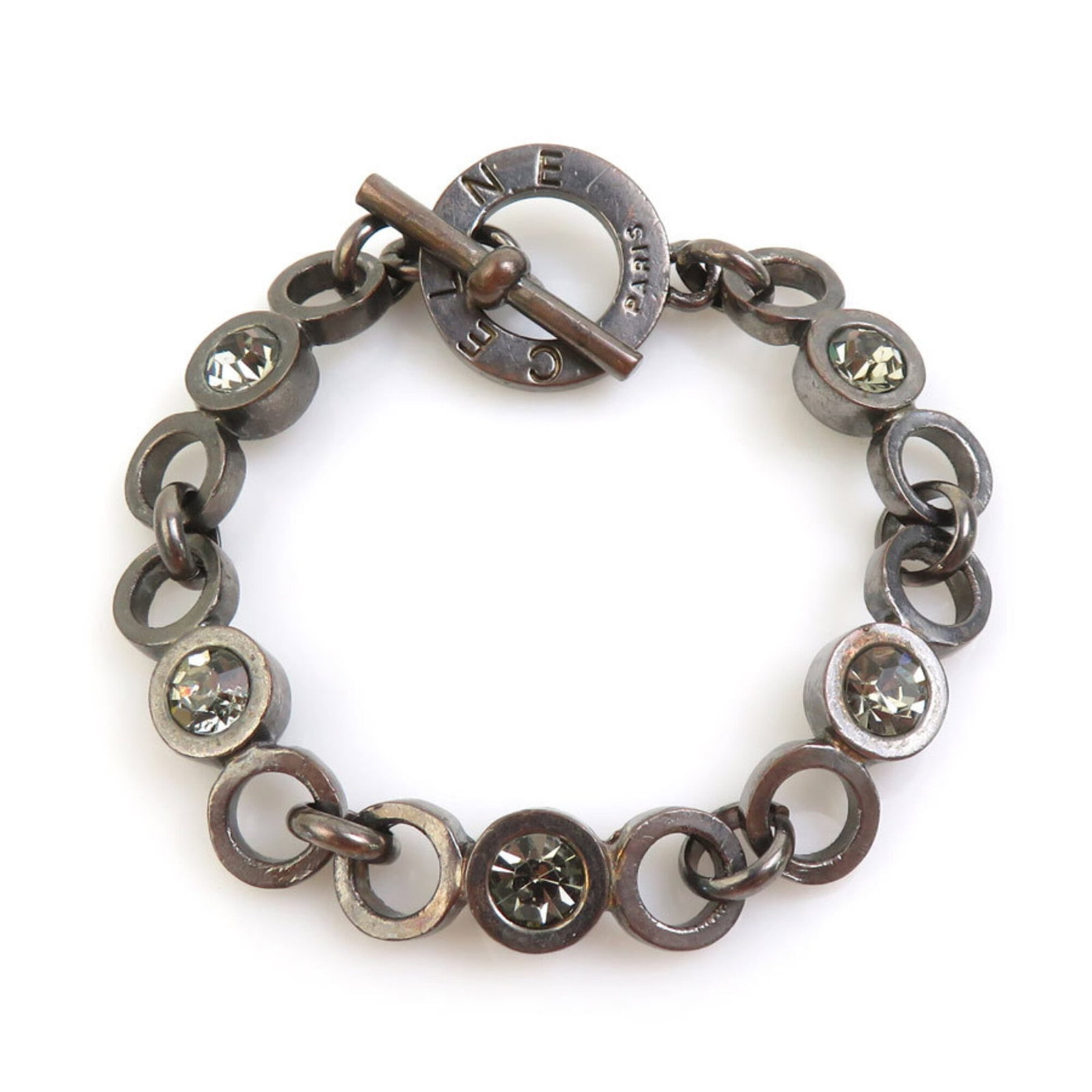 Celine Charm Bracelet Metal: Celine Charm Bracelet Metal Gunmetal charm bracelet from Celine, featuring a sleek metal design with a length of 16cm and width of 8mm. This compact charm bracelet is perfect for everyday wear, with i
