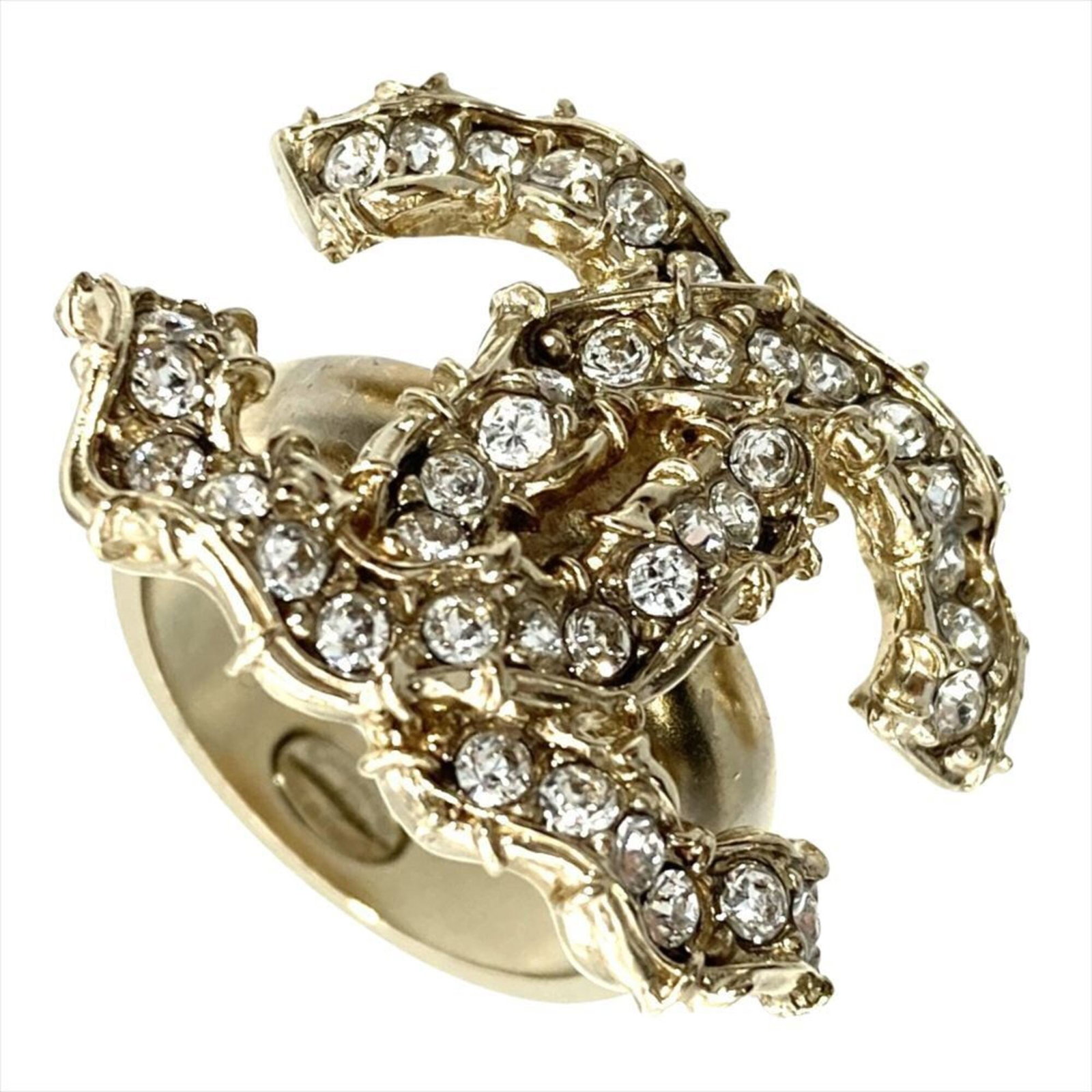 Ring band metal Chanel: Ring band metal Chanel Metal band ring from Chanel, made in France with a rhinestone stone and available in US size 6.5 and JP size 12. The ring features a width of 4.77mm and is crafted from metal.