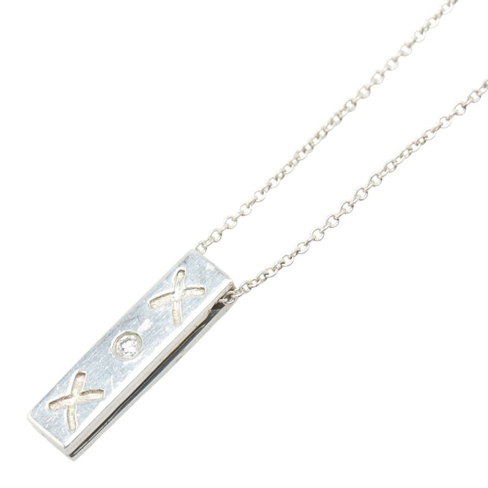 Tiffany & Co. Kiss Bar Single Diamond Necklace In 925 Silver For Women. Tiffany: Tiffany & Co. Kiss Bar Single Diamond Necklace In 925 Silver For Women. Tiffany Tiffany & Co. Kiss Bar Single Diamond Necklace in 925 Silver showcases a stunning single diamond set against a sleek sil