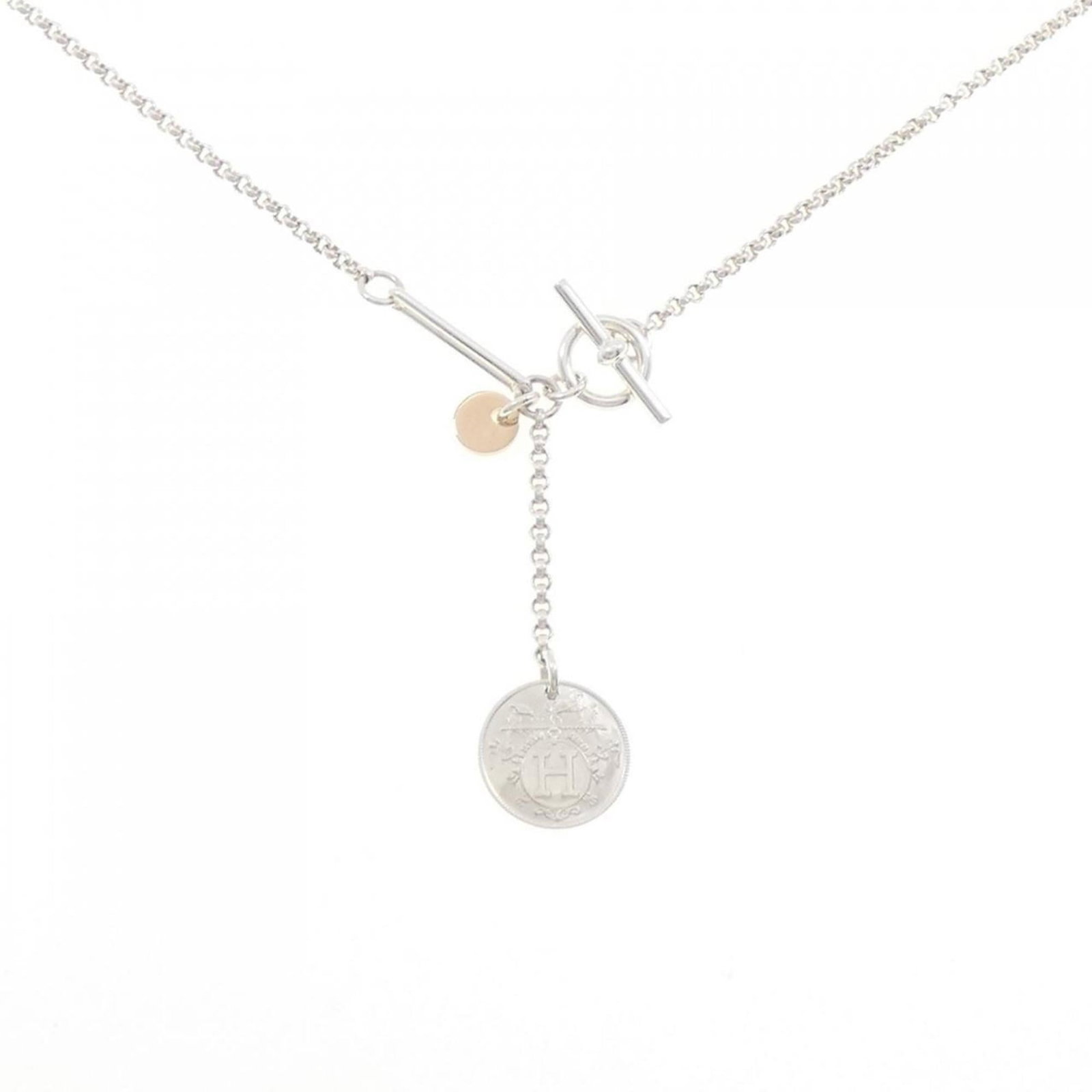 Hermes Necklace Exlibris: Hermes Necklace Exlibris Pink gold (18K) and silver 925 combine in this elegant Hermes Necklace Exlibris, featuring a pendant with dimensions of 40.2mm x 12.9mm. The necklace's circumference is