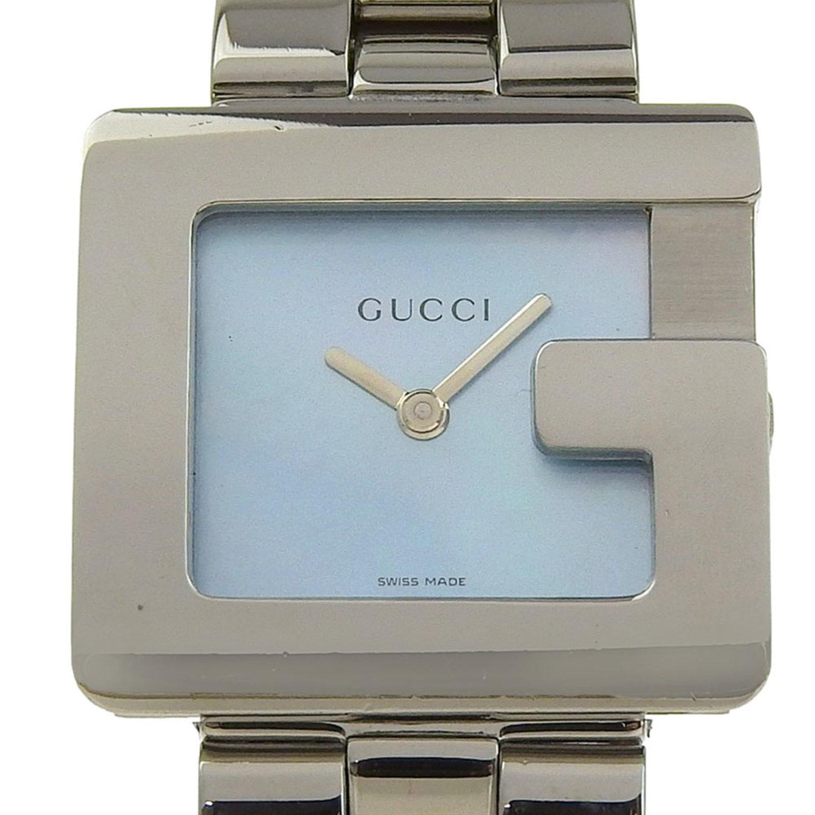 Gucci Wristwatch: Gucci Wristwatch Stainless steel case and band, the Gucci wristwatch boasts a sleek blue shell dial. Measuring 25mm in diameter, it's designed to fit wrists up to 15cm in size. This quartz-powered