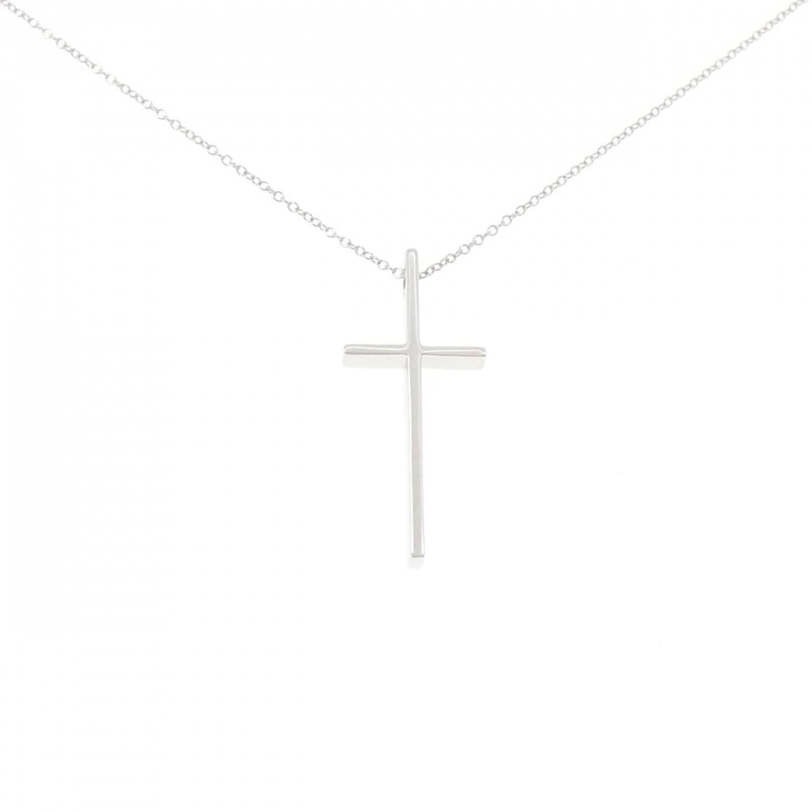 Cross Necklace by Tiffany: Cross Necklace by Tiffany White gold (18K) pendant on a chain, measuring 30.2mm x 13.4mm and set in a necklace with a 48 cm circumference, crafted by Tiffany. The pendant itself weighs 5.3g and has a