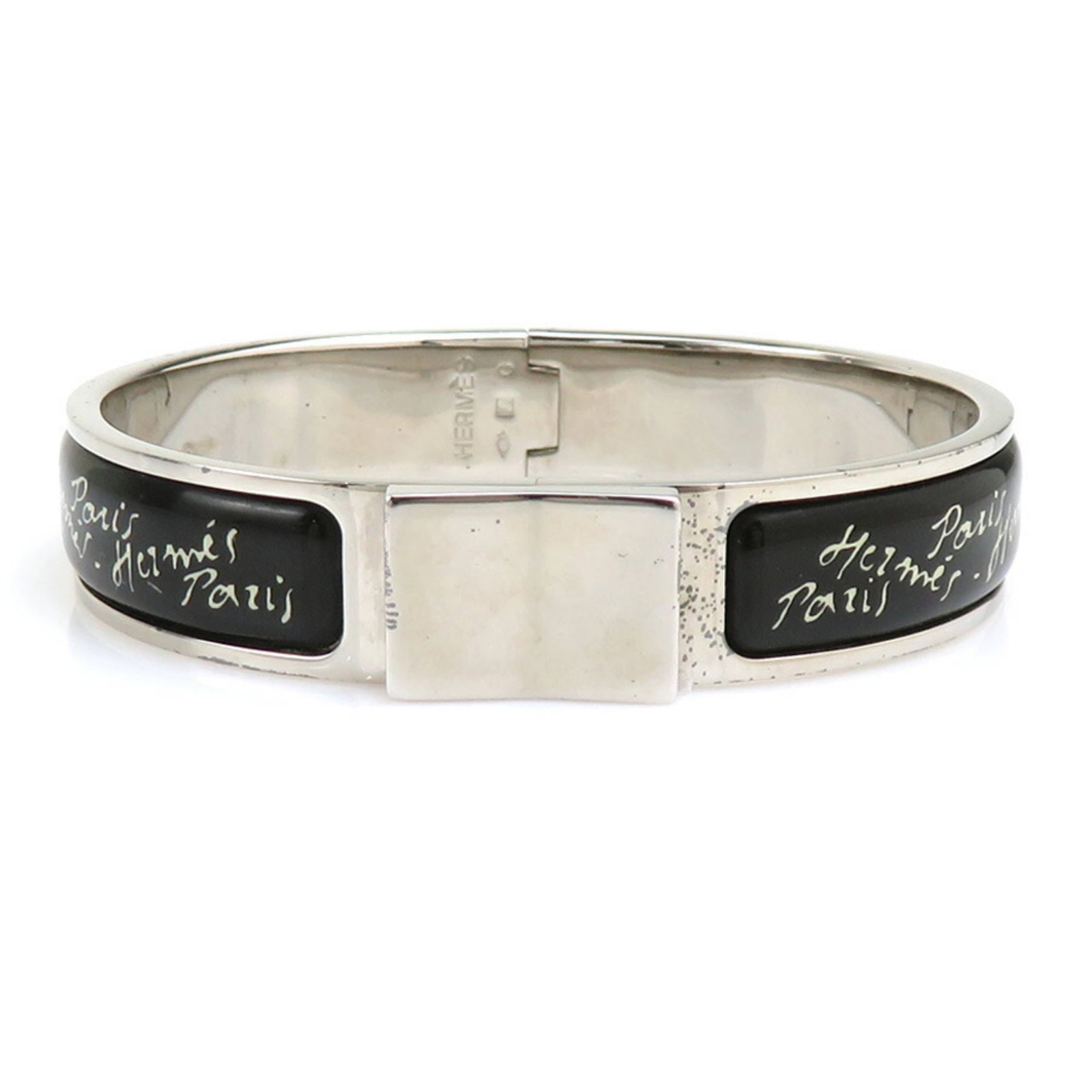 Metal Bangle Hermes: Metal Bangle Hermes Metal bangle from Hermes, featuring enamel and metal construction in black and silver hues. The bangle measures 15.7cm in length. It bears a signature. Item Specifics: Brand: Herme
