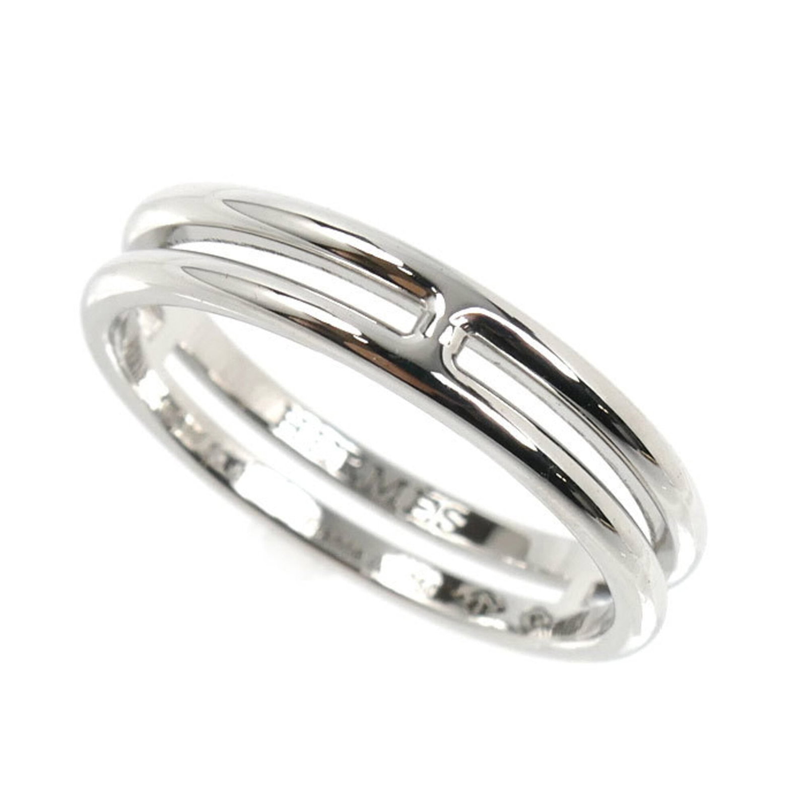 Hermes white gold band ring 18k: Hermes white gold band ring 18k White gold (18K) band ring from Hermes, featuring a sleek and sophisticated design. This 50 US Size 5.5 band ring boasts the iconic brand's signature style, crafted