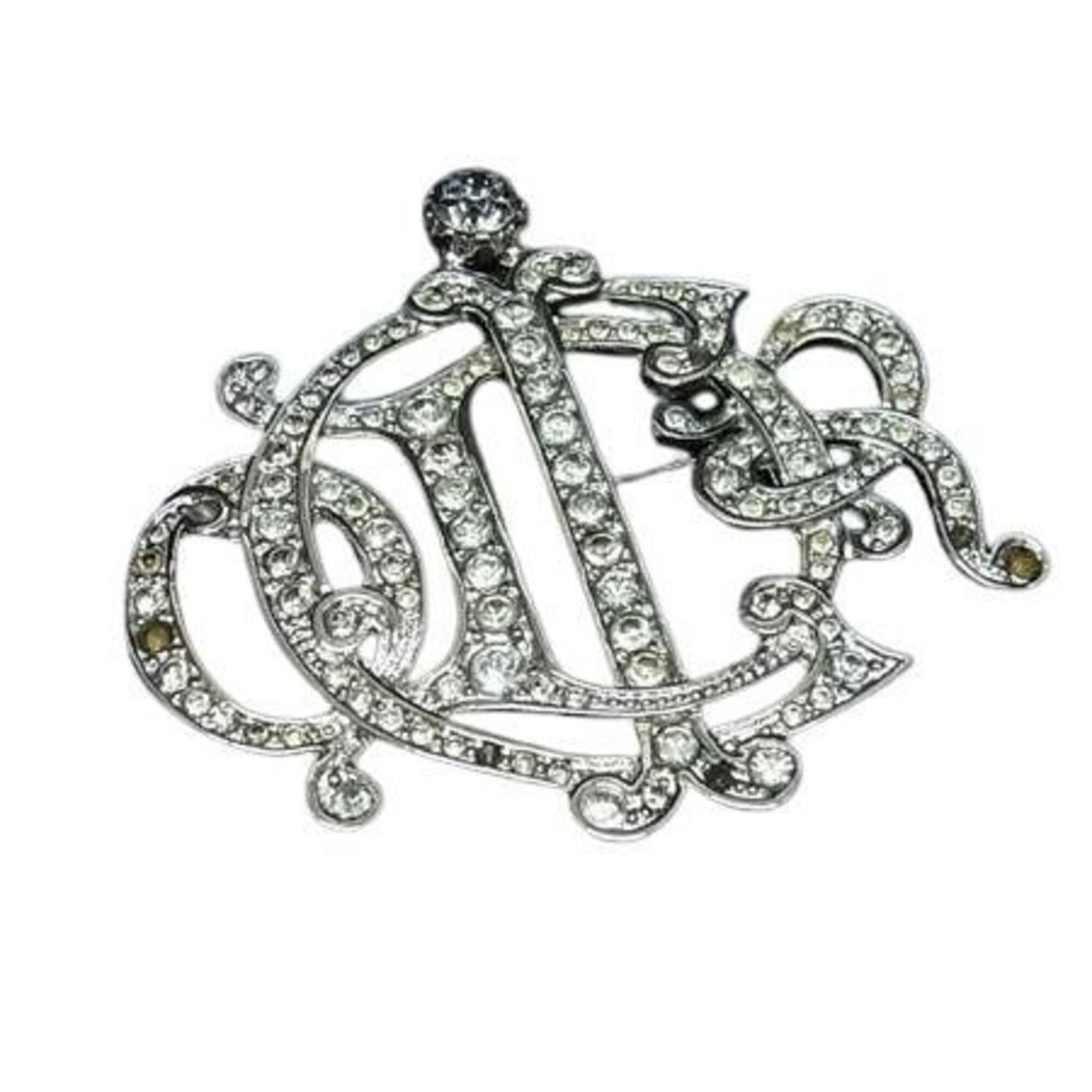 Metal Christian Dior Brooch: Metal Christian Dior Brooch The Metal Christian Dior Brooch boasts an elegant silver finish, measuring 4.7cm x 5cm in size. This striking piece bears a signature, adding a touch of sophistication to