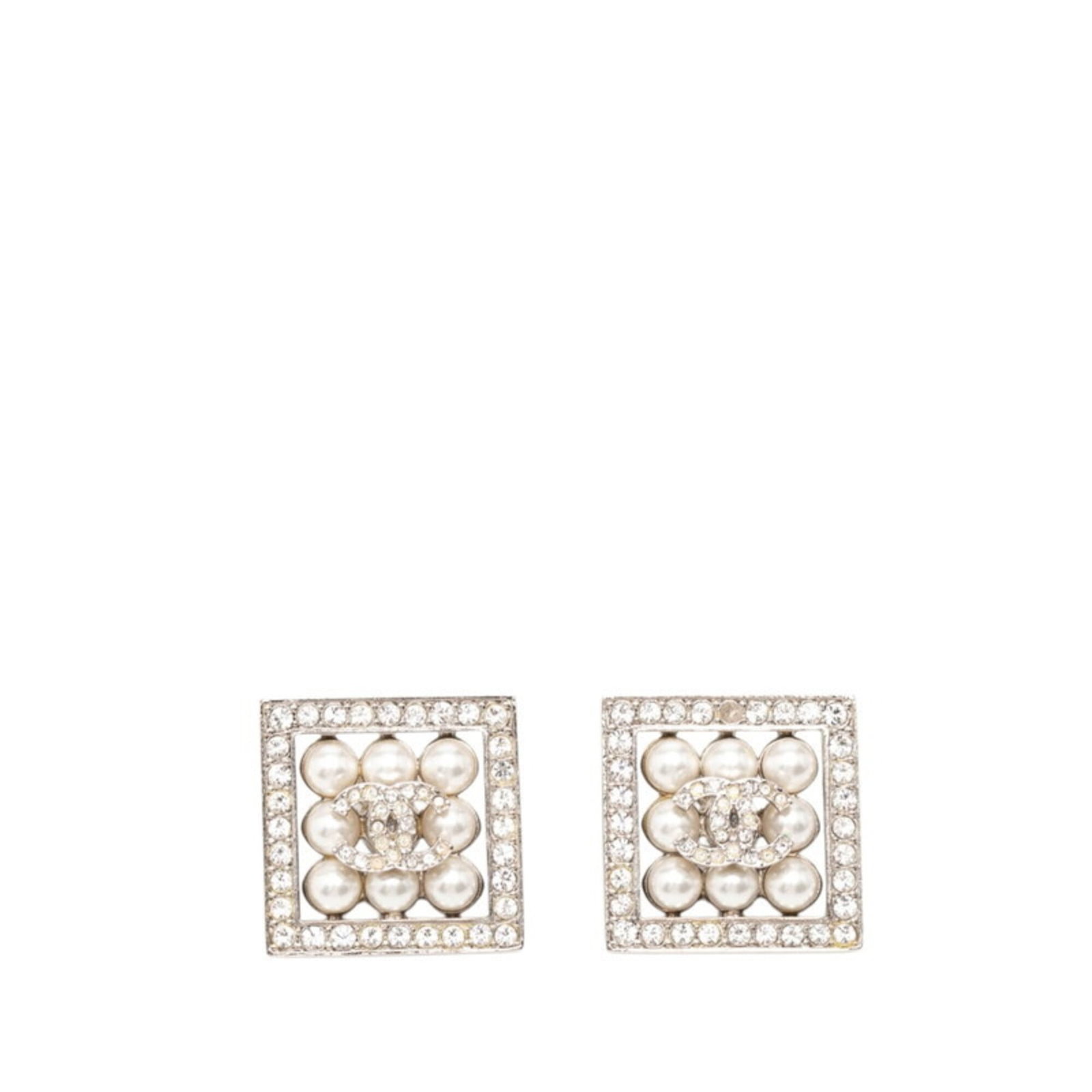 Chanel Stud Earrings Metal Rhinestone: Chanel Stud Earrings Metal Rhinestone Stud earrings from the iconic Chanel brand, featuring metal and rhinestone details in silver. The earrings measure 19.70mm x 19.70mm / 0.78'' x 0.78''. They bear 