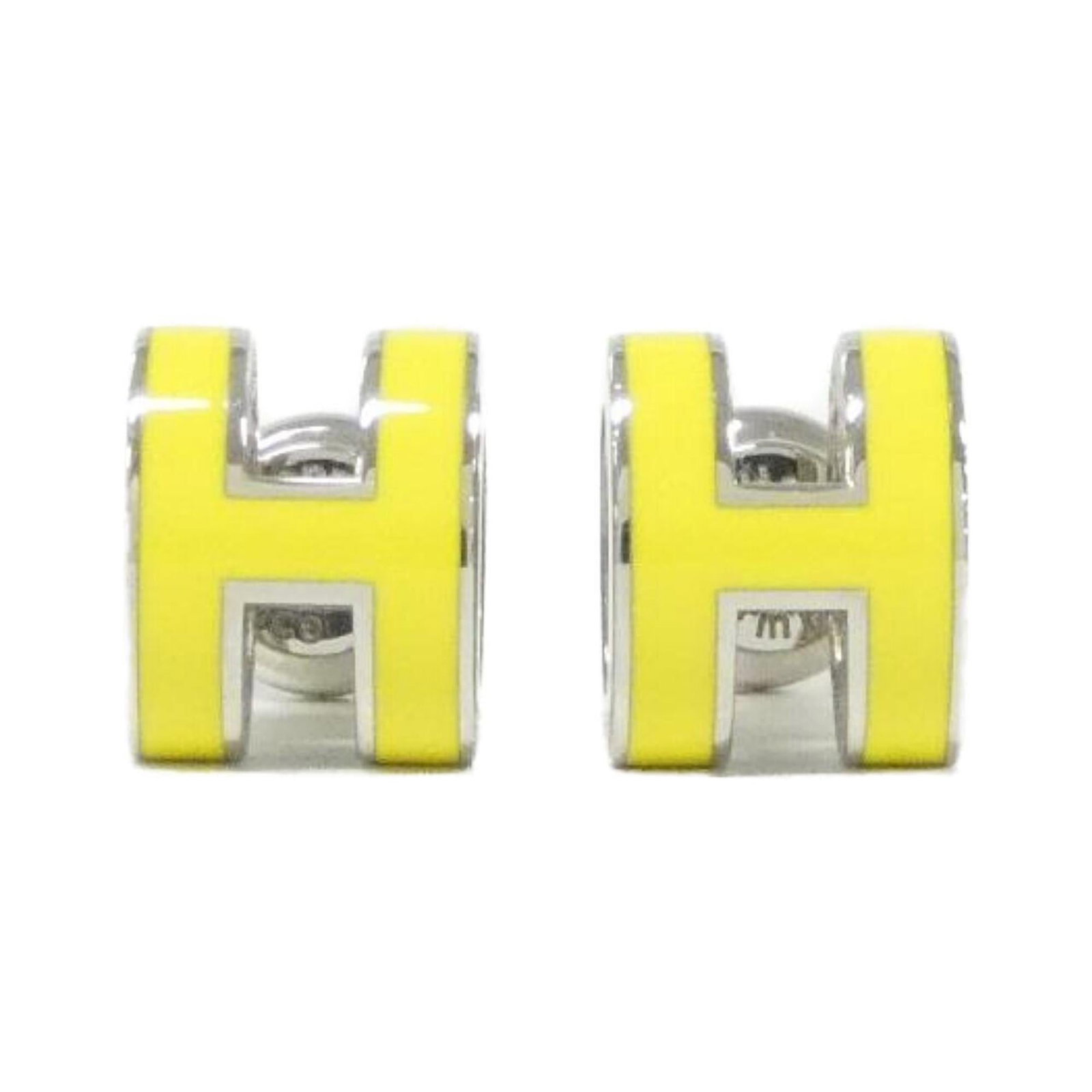 Stud Hermes Earrings: Stud Hermes Earrings Stud earrings from Herm?s feature vibrant lime, silver, and yellow colors. The sleek design measures 9.00mm x 7.00mm in size, with a compact 0.35'' x 0.28'' profile. Made by the