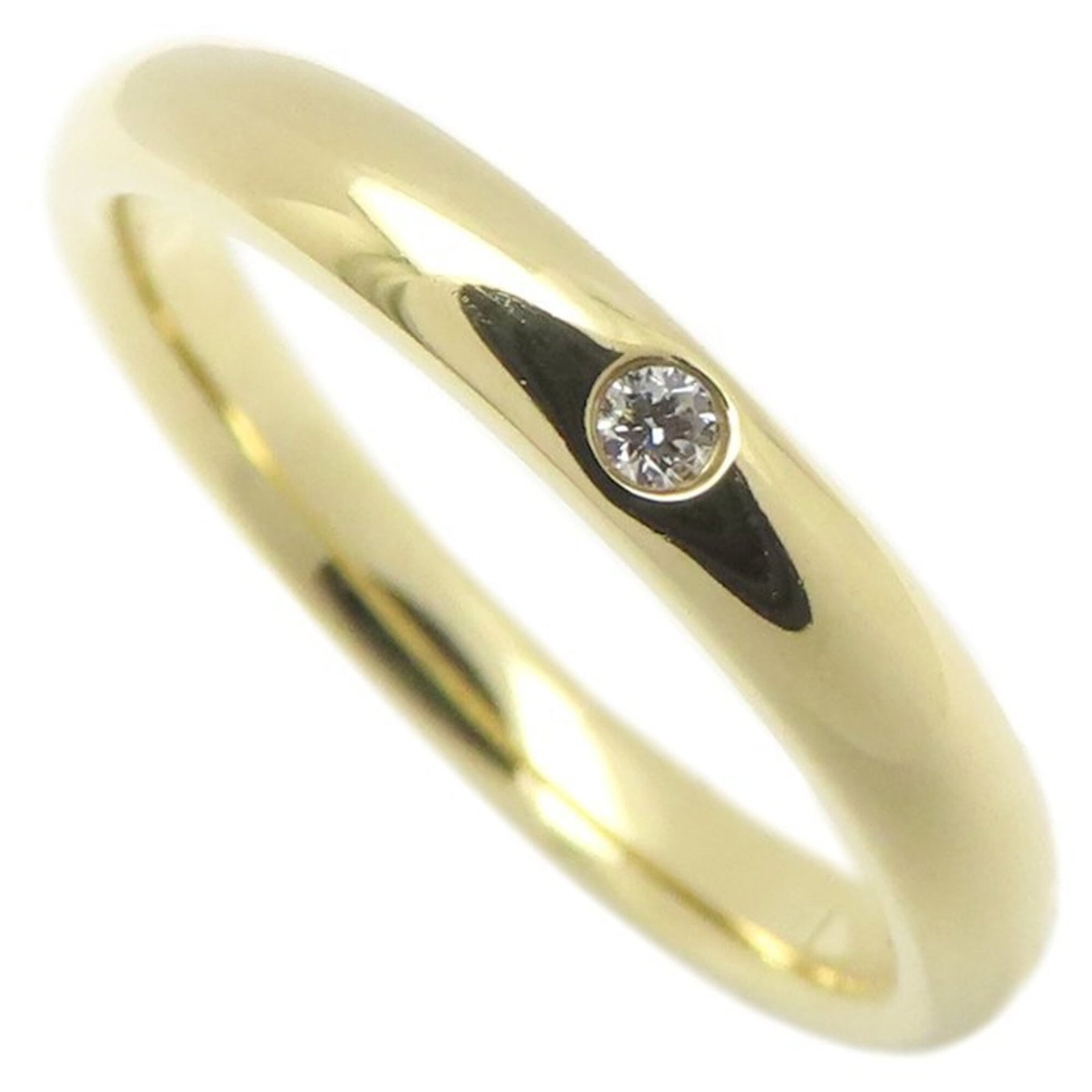 Tiffany gold ring band yellow: Tiffany gold ring band yellow Yellow gold (18K) Tiffany band ring features a diamond stone, available in US size 6.5 and JP size 13. The ring's width is 2.8mm and weighs 3.9g. Item Specifics: Brand: