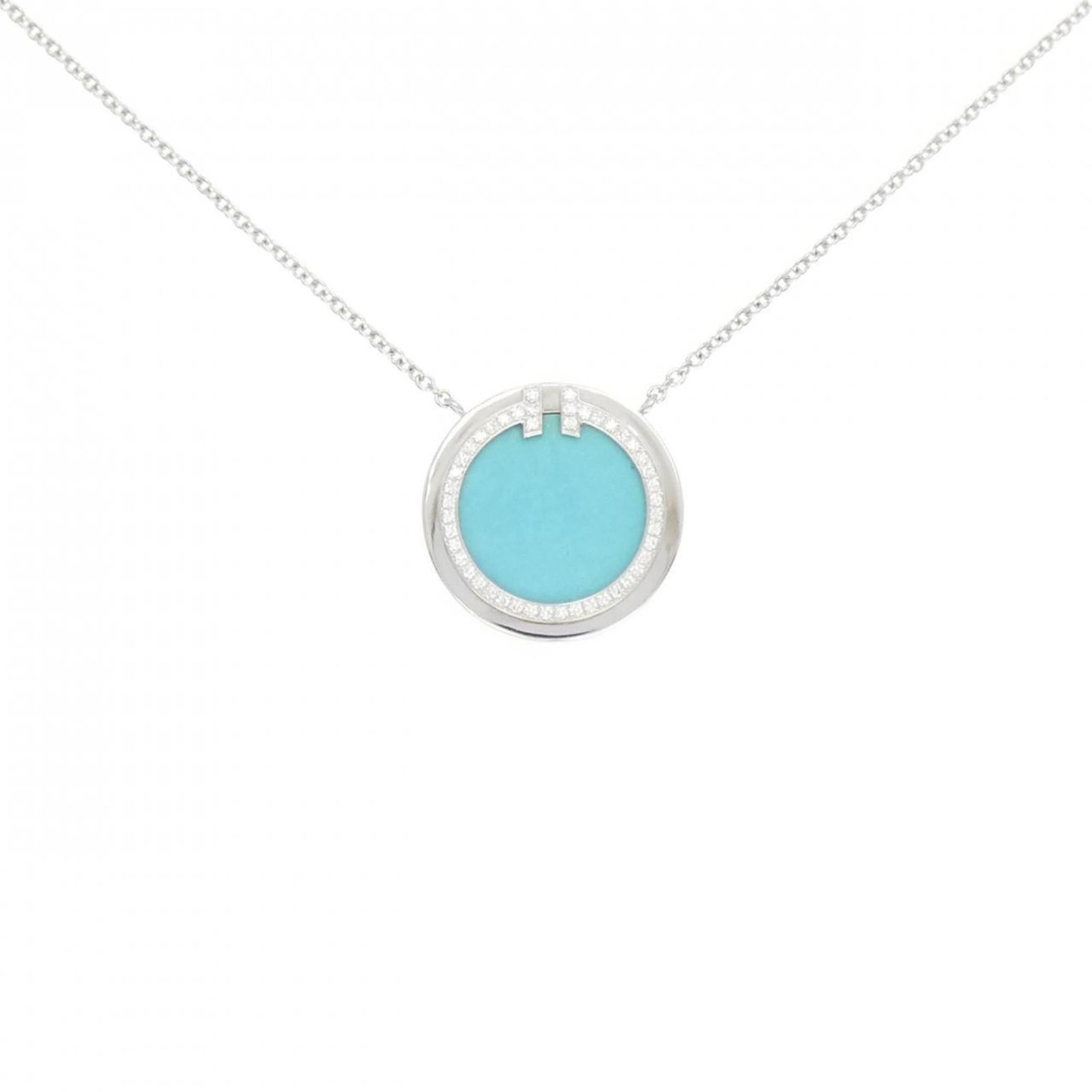 Circle Tiffany T Necklace: Circle Tiffany T Necklace White gold necklace with a 16mm diameter Circle Tiffany T pendant, featuring a diamond and turquoise stone. The necklace has an adjustable length of 40 cm - 45 cm and weighs