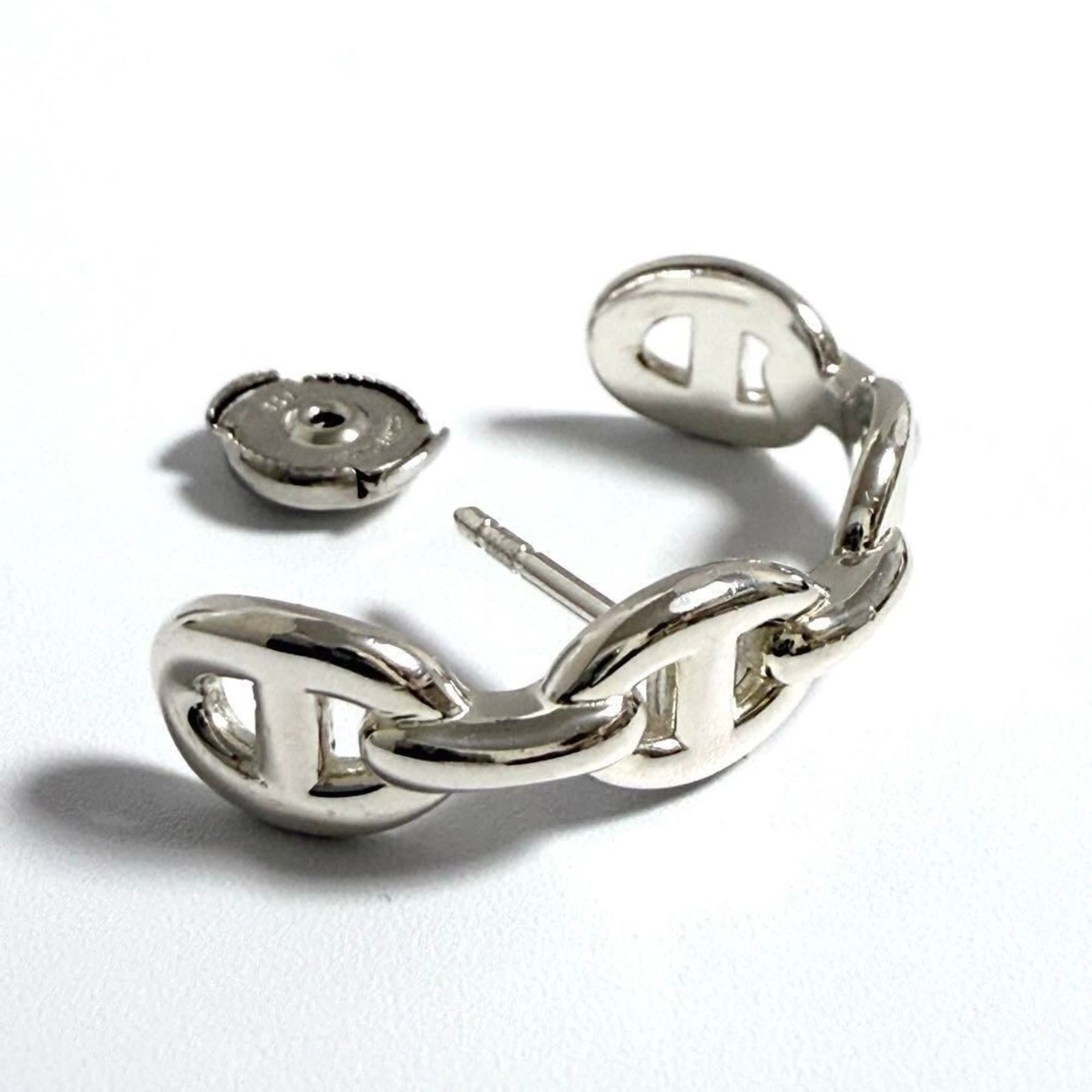 Hermes Stud Silver Earrings 925: Hermes Stud Silver Earrings 925 Silver 925 stud earrings from Hermes, featuring a sleek and modern design. Made from high-quality silver, these earrings are a stylish addition to any outfit. With thei