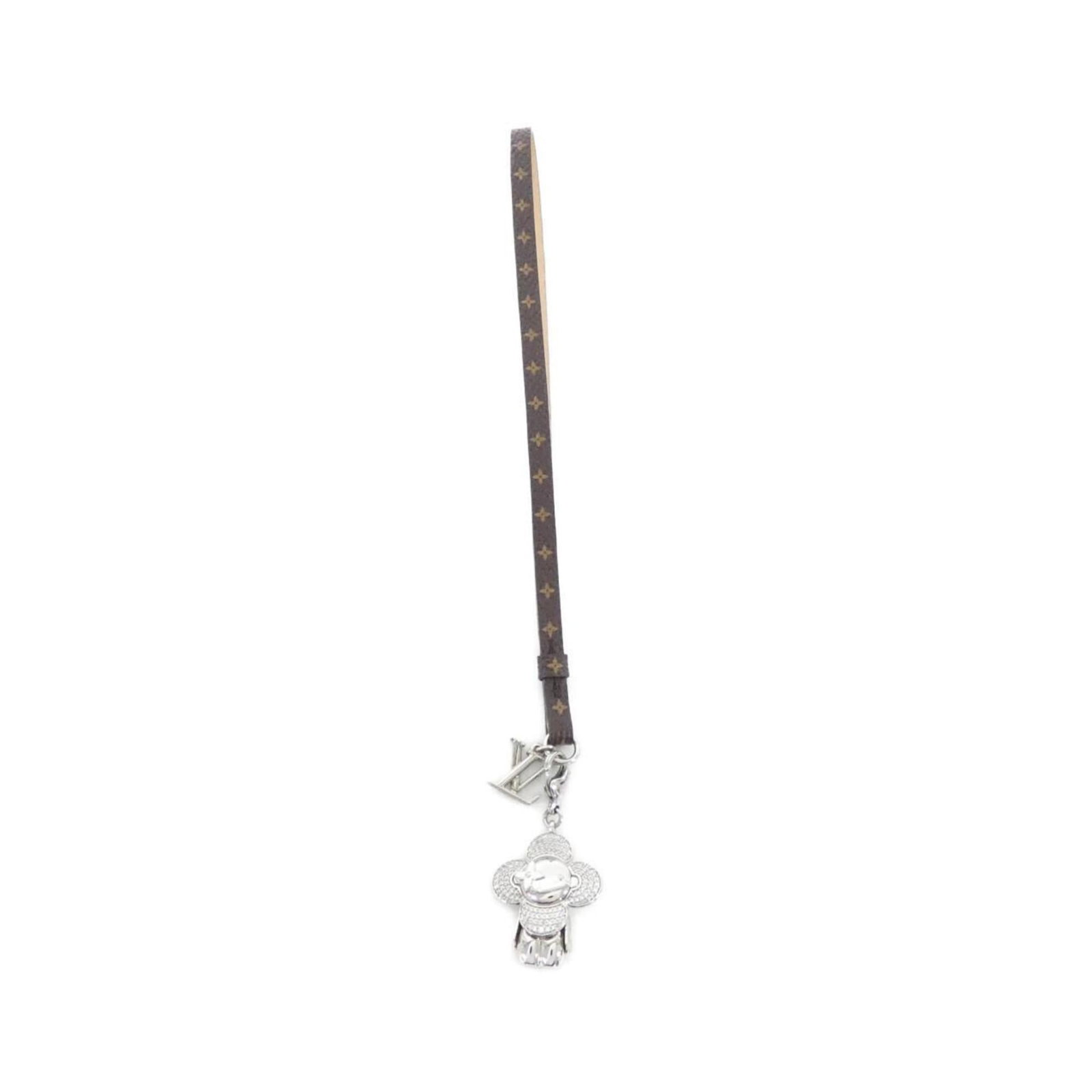 Louis Vuitton Handbag Charm: Louis Vuitton Handbag Charm The Louis Vuitton Handbag Charm boasts its iconic Monogram design, perfectly capturing the essence of the brand's signature style. Measuring 45mm x 25mm and attached to a