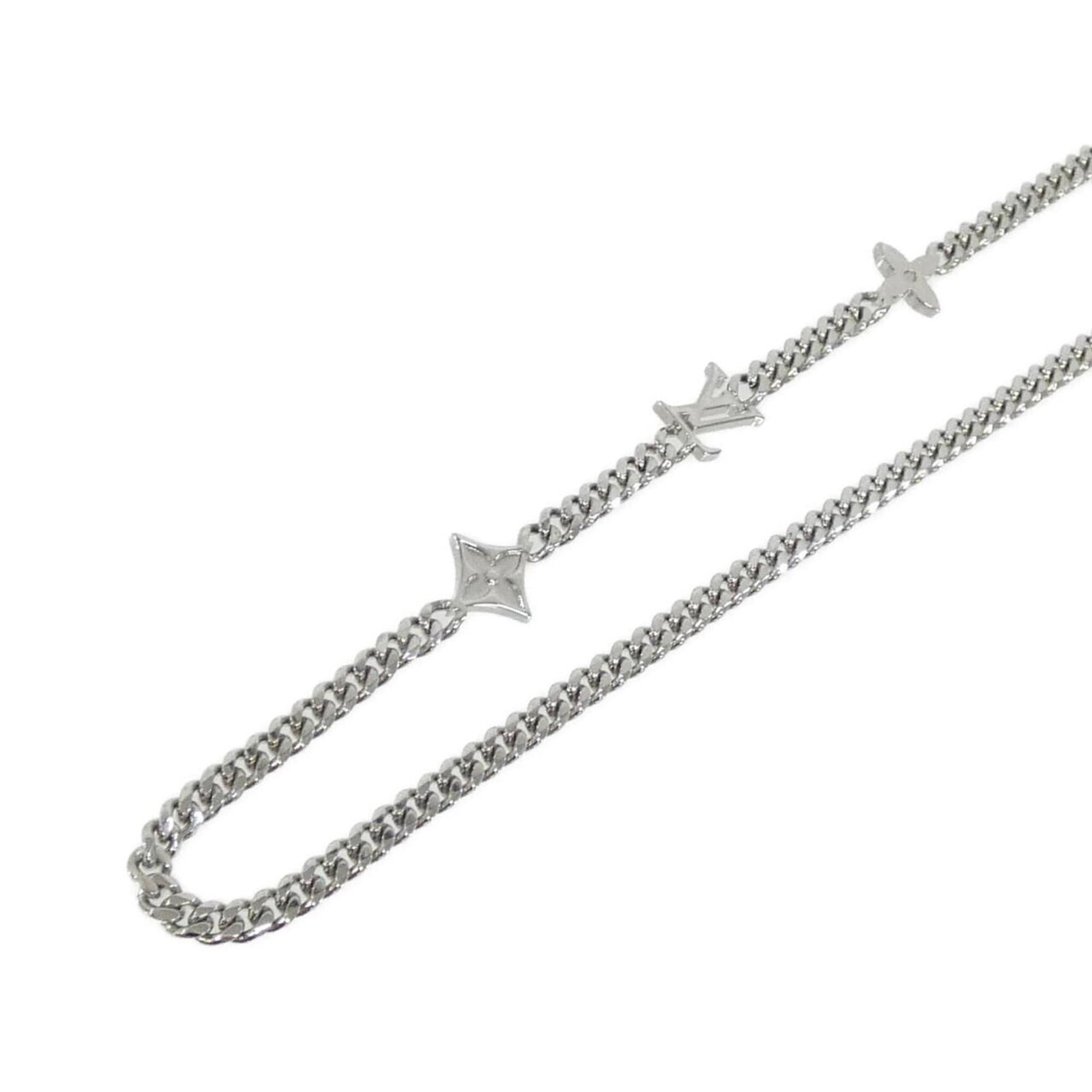 Monogram Low Necklace from Louis Vuitton: Monogram Low Necklace from Louis Vuitton Silver Monogram Low Necklace from Louis Vuitton, featuring the iconic monogram pattern, is available for purchase. The necklace boasts a sleek design with a lo