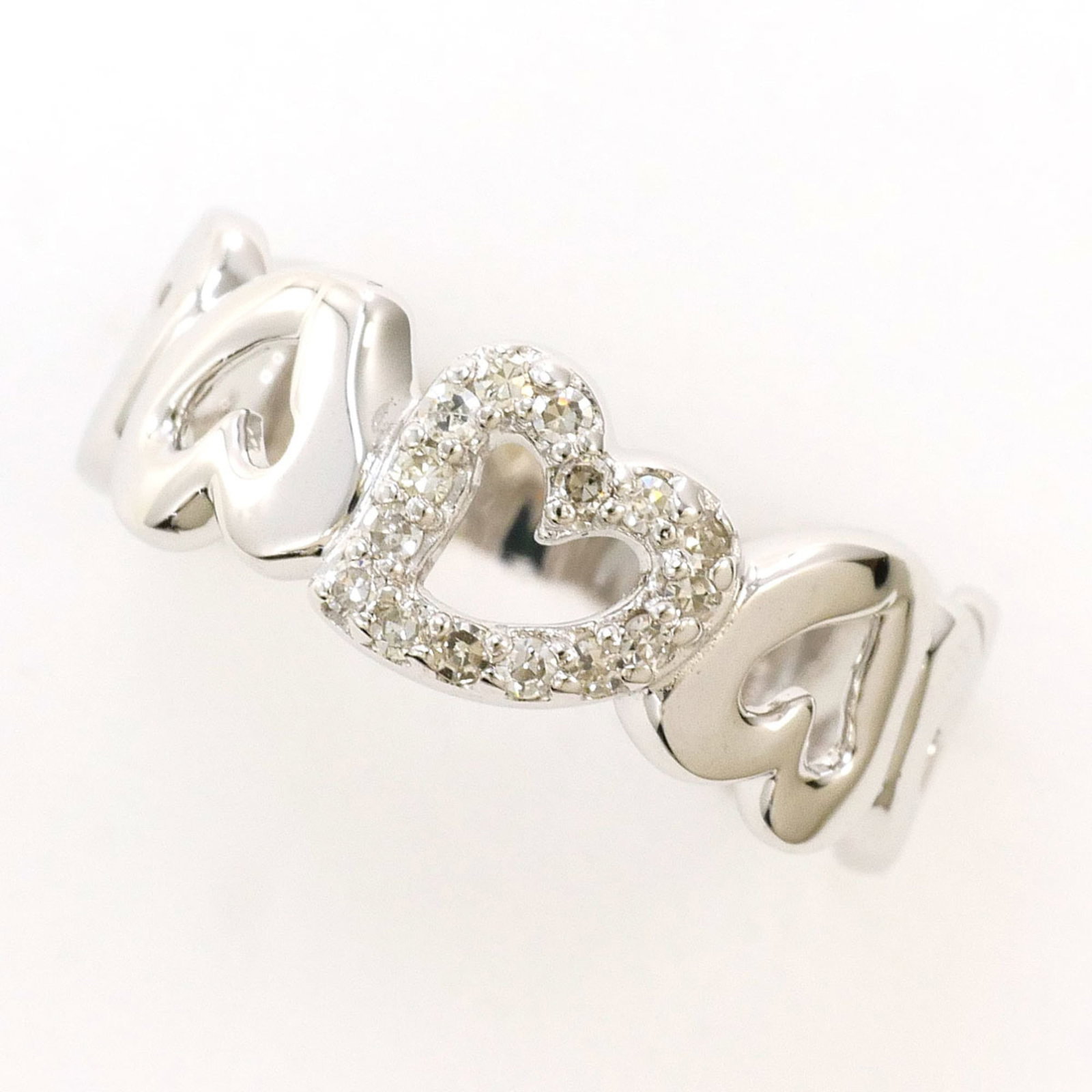 Unbranded Band Ring White Gold (14K): Unbranded Band Ring White Gold (14K) 14K white gold band ring with a diamond stone, available in US size 3.5 and Japanese size 5, featuring a 6mm width and weighing 2.1g. This unbranded piece