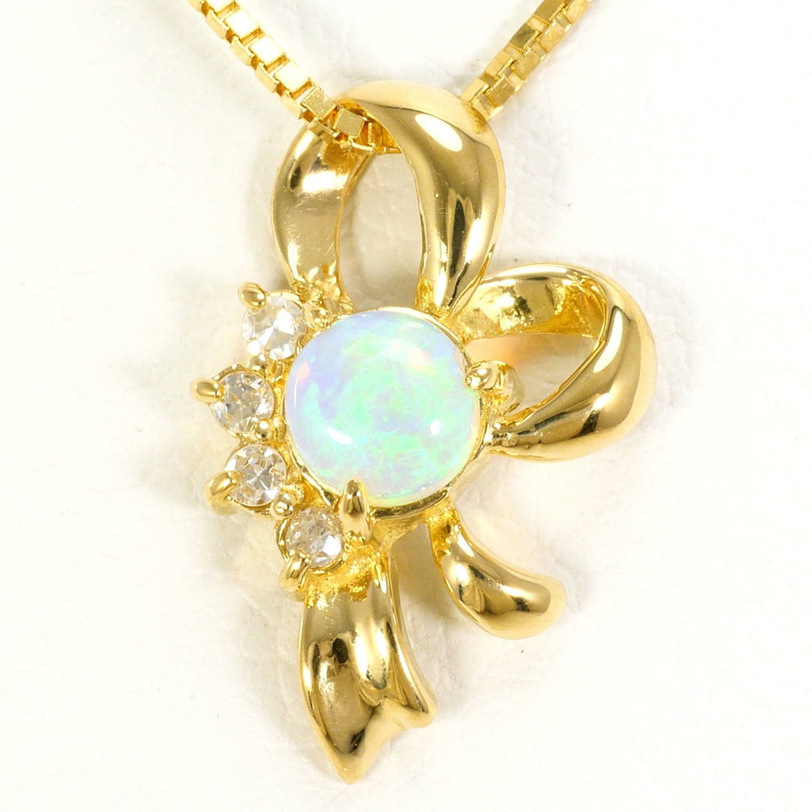 18K (18-Karat) Yellow Gold Necklace With Opal And Diamond (Carat Mark Not Specified). Total Weight: 18K (18-Karat) Yellow Gold Necklace With Opal And Diamond (Carat Mark Not Specified). Total Weight 18K yellow gold necklace with opal and diamond pendant, showcasing the elegance of 18K metalwork.
