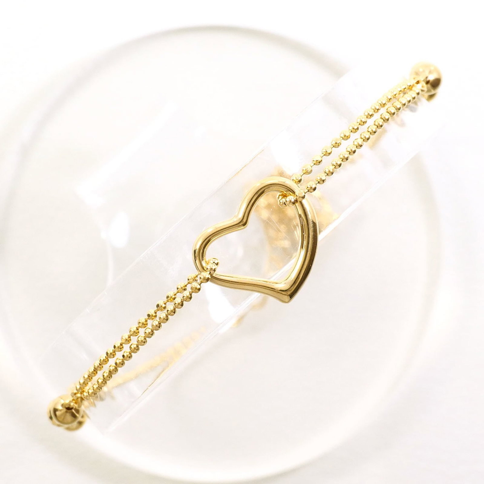 Yellow Gold Charm Unbranded Bracelet: Yellow Gold Charm Unbranded Bracelet Yellow gold (18K) charm bracelet with a length of 25cm / 9.84'' and weight of 2.1g / 0.07oz, made from high-quality yellow gold metal. This unbranded charm