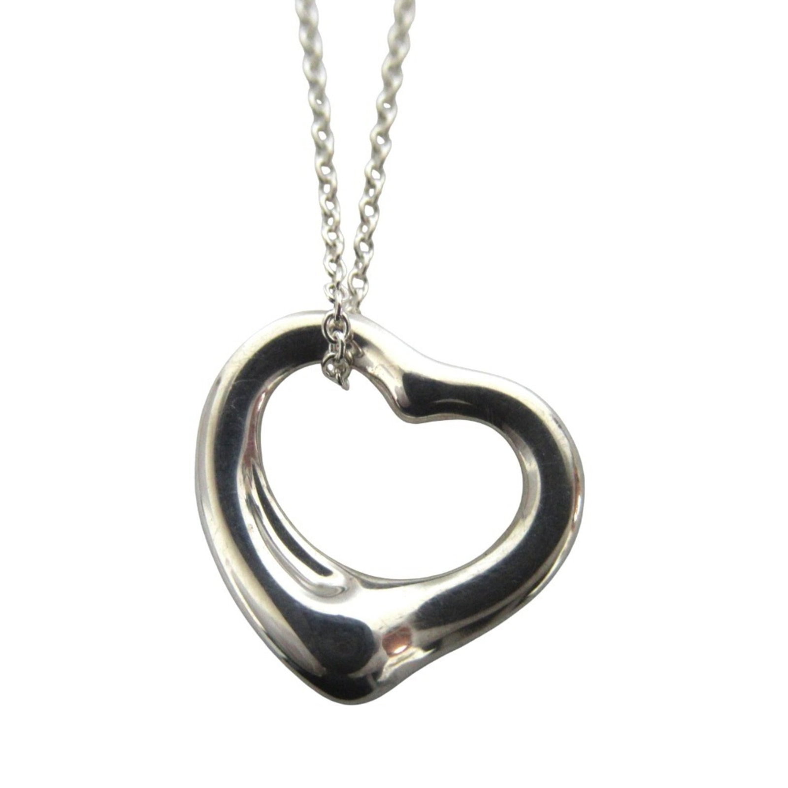 Elsa Peretti Open Heart Necklace Pendant Sterling Silver Women's Tiffany Co: Elsa Peretti Open Heart Necklace Pendant Sterling Silver Women's Tiffany Co Sterling silver pendant necklace featuring an open heart design from Tiffany & Co. This elegant piece measures 14mm x 15mm
