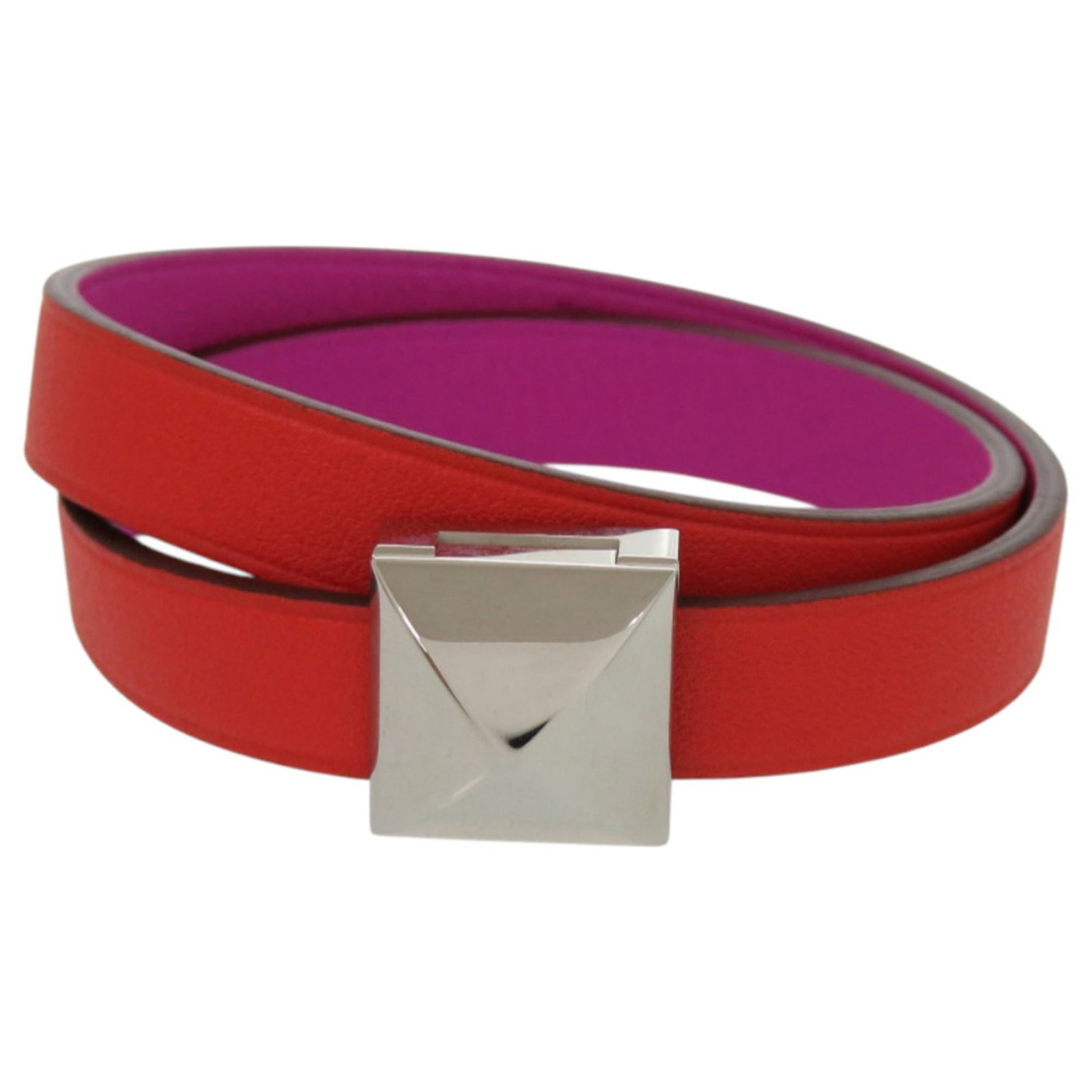 Metal leather bracelet charm by Hermes: Metal leather bracelet charm by Hermes T2 Metal leather bracelet by Hermes features a unique bicolor design with orange and purple accents, showcasing the brand's signature style. The charm bracelet b