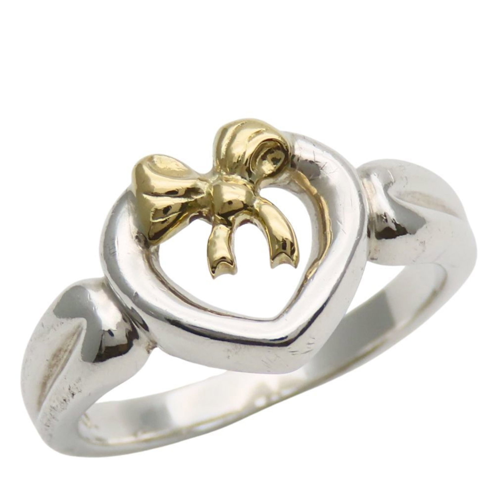 Tiffany Band Ring Silver 925 Yellow Gold (18K): Tiffany Band Ring Silver 925 Yellow Gold (18K) Silver and yellow gold band ring from Tiffany, made with 925 silver and 18K yellow gold. This elegant ring features a classic design that suits women's