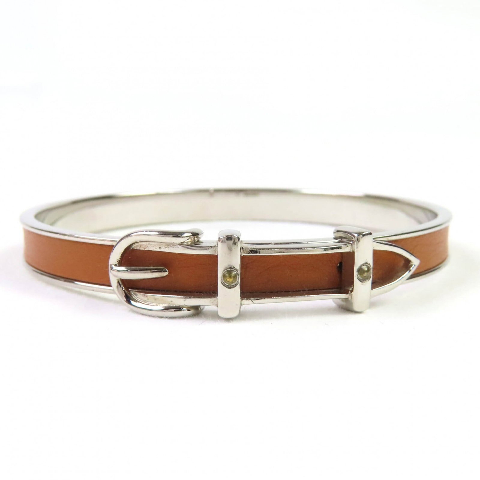 Hermes Bangle: Hermes Bangle Brown and silver, the Hermes bangle measures 19cm in length. Brought to you from France, this women's accessory boasts a classic design that has become synonymous with luxury fashion. It
