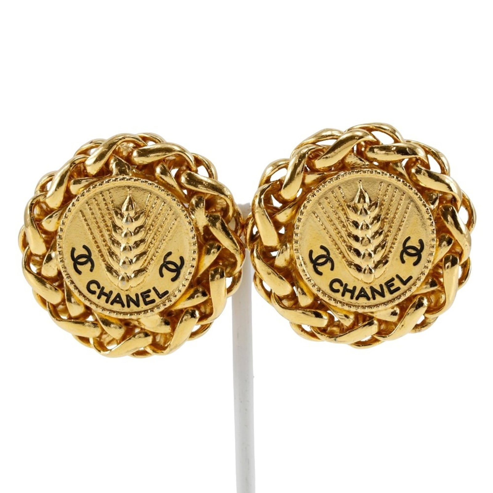 Clip earrings by Chanel: Clip earrings by Chanel Clip earrings by Chanel, crafted in gold and bearing the brand's signature style, date back to 1988. Measuring 35mm x 35mm and weighing 50g, these vintage clip earrings showcas
