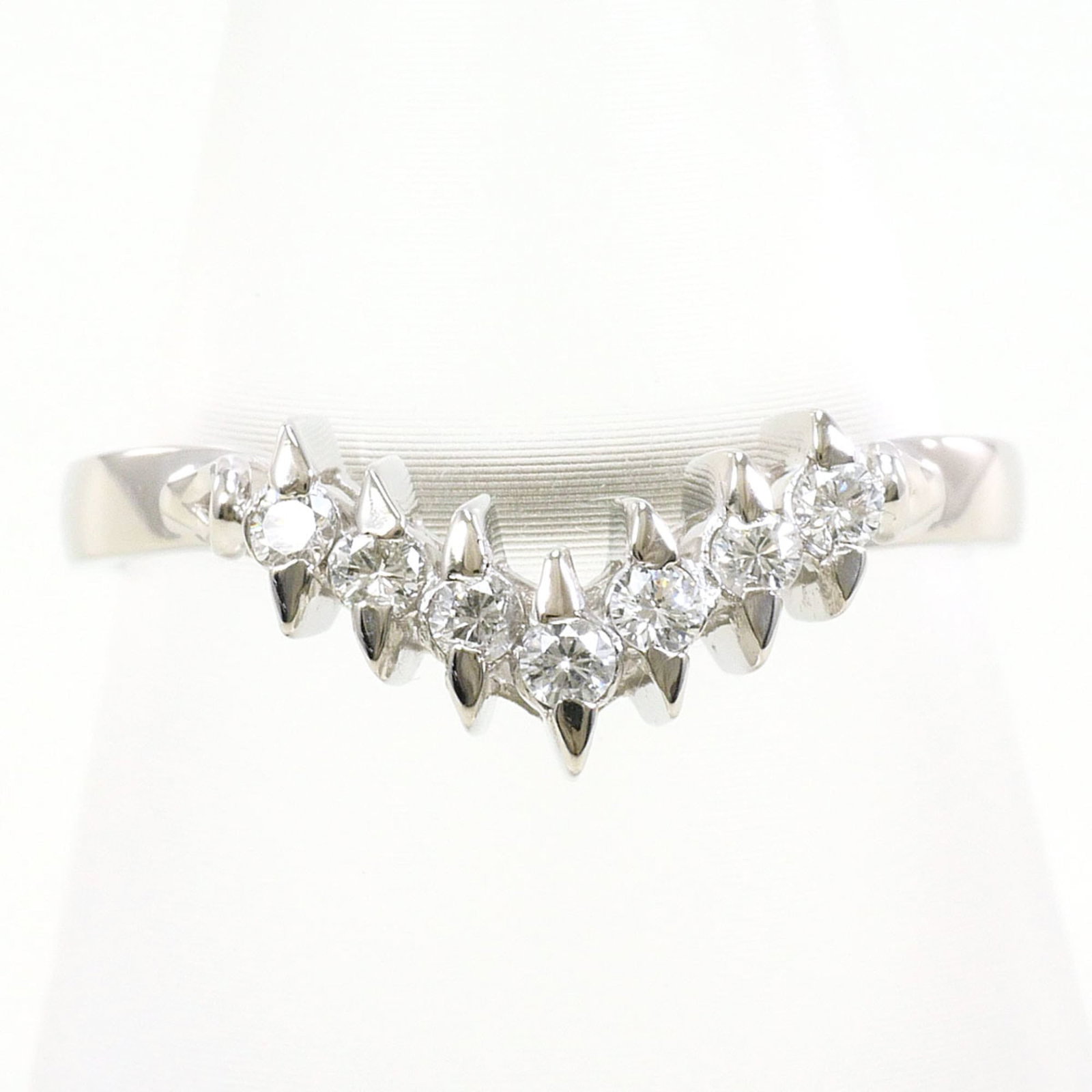 Ring Band Platinum Unbranded 900: Ring Band Platinum Unbranded 900 Platinum band ring features a diamond stone weighing 0.14 carats, set in a platinum metal construction with a US size 6 and Japanese size 11 fit. The ring measures