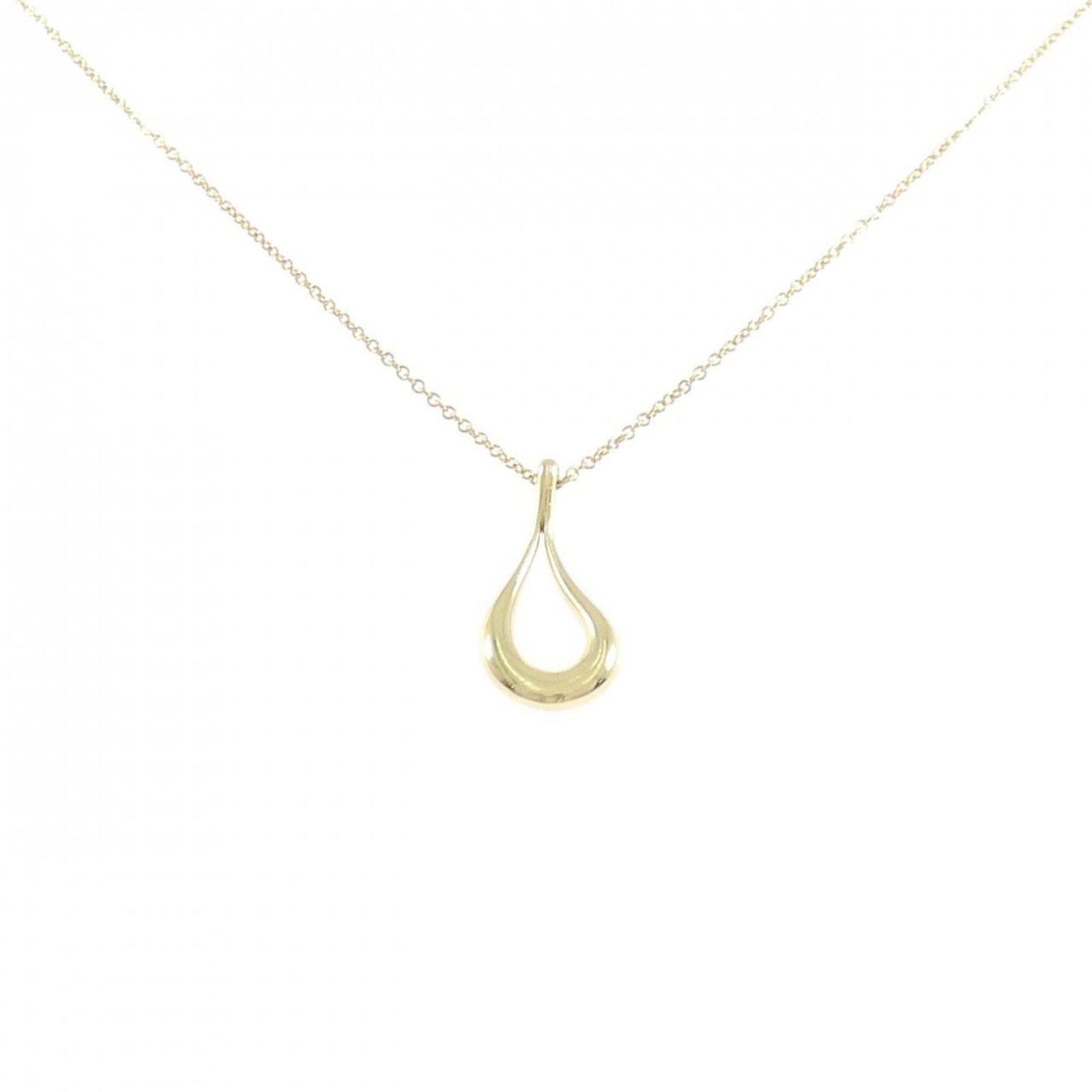 Open Teardrop Necklace by Tiffany: Open Teardrop Necklace by Tiffany Yellow gold (18K) pendant adorns a sleek open teardrop design, adding a touch of elegance to any outfit. The necklace features a yellow gold chain with a
