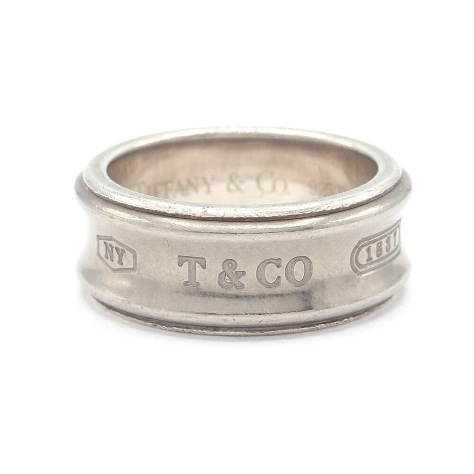 Sterling silver titanium band ring by Tiffany: Sterling silver titanium band ring by Tiffany Sterling silver and titanium band ring by Tiffany, available in US size 6.5 and Japanese size 13.5, features a unique combination of materials for added d