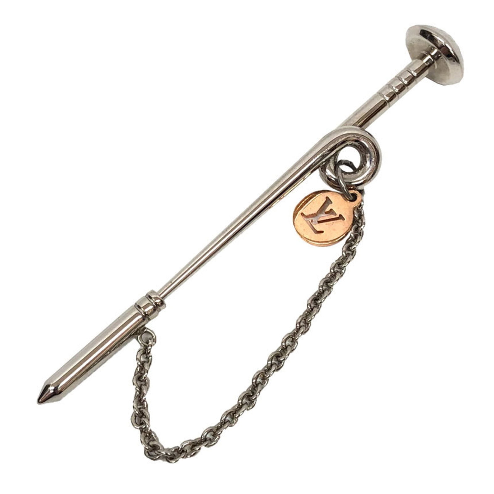 Louis Vuitton metal brooch: Louis Vuitton metal brooch Silver Louis Vuitton metal brooch. This piece bears the signature of its creator, made from high-quality metal with a sleek silver finish. A stylish accessory for those who